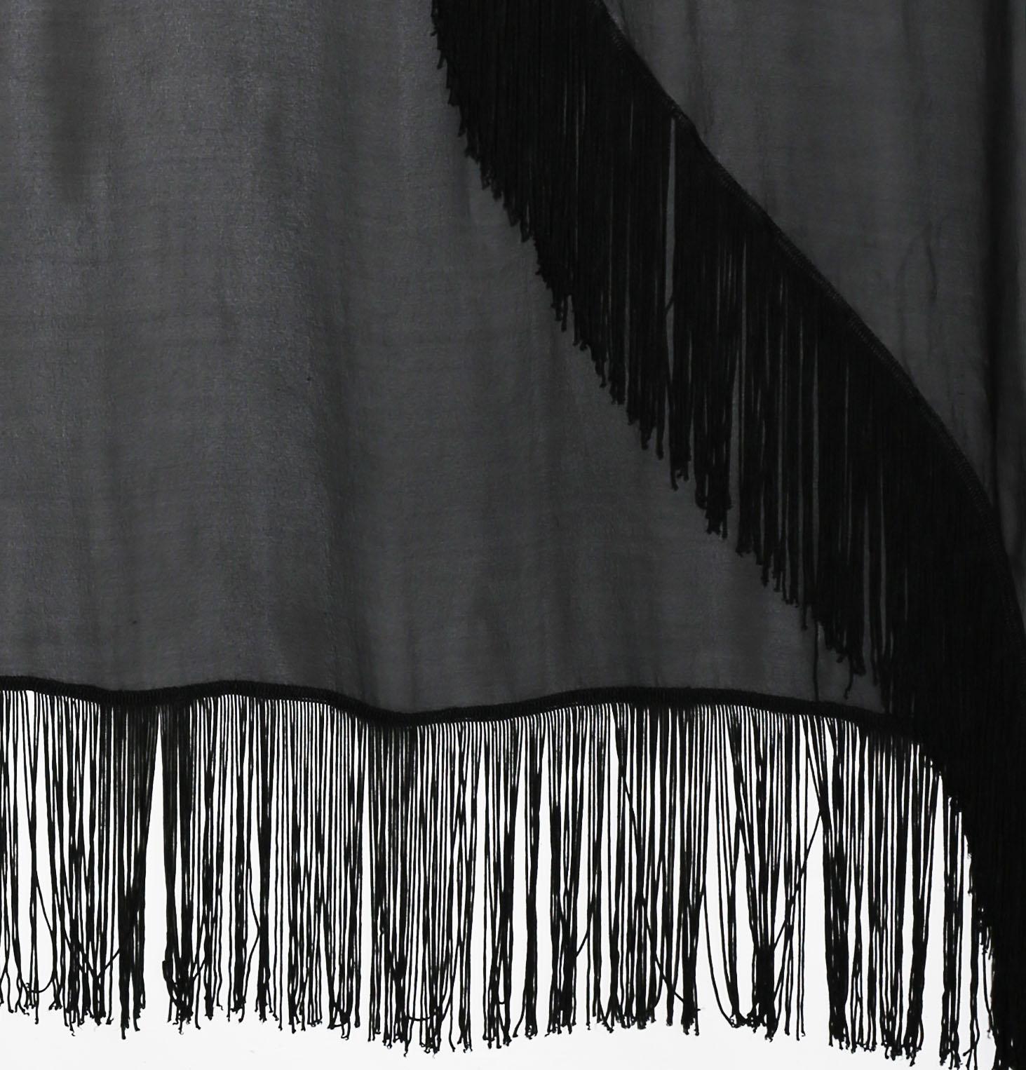 Giorgio Armani black large  fringed shawl  has a wide border of the same fabric with faggoted edges on all sides. This shawl will add that 