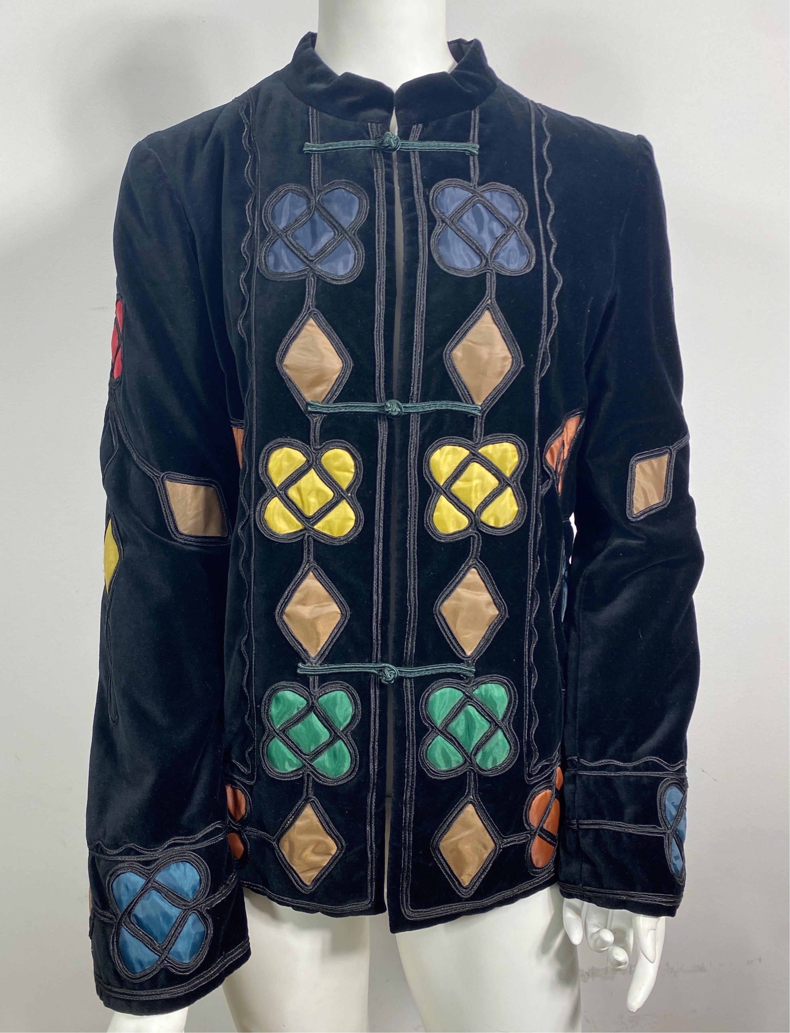 Giorgio Armani Black Velvet Jacket with Silk Geometric Inserts - Size 8  This beautiful evening velvet jacket has a 1.25” mandarin collar, is full lined, has multi colored silk geometric shaped inserts with black cording detail outlining the