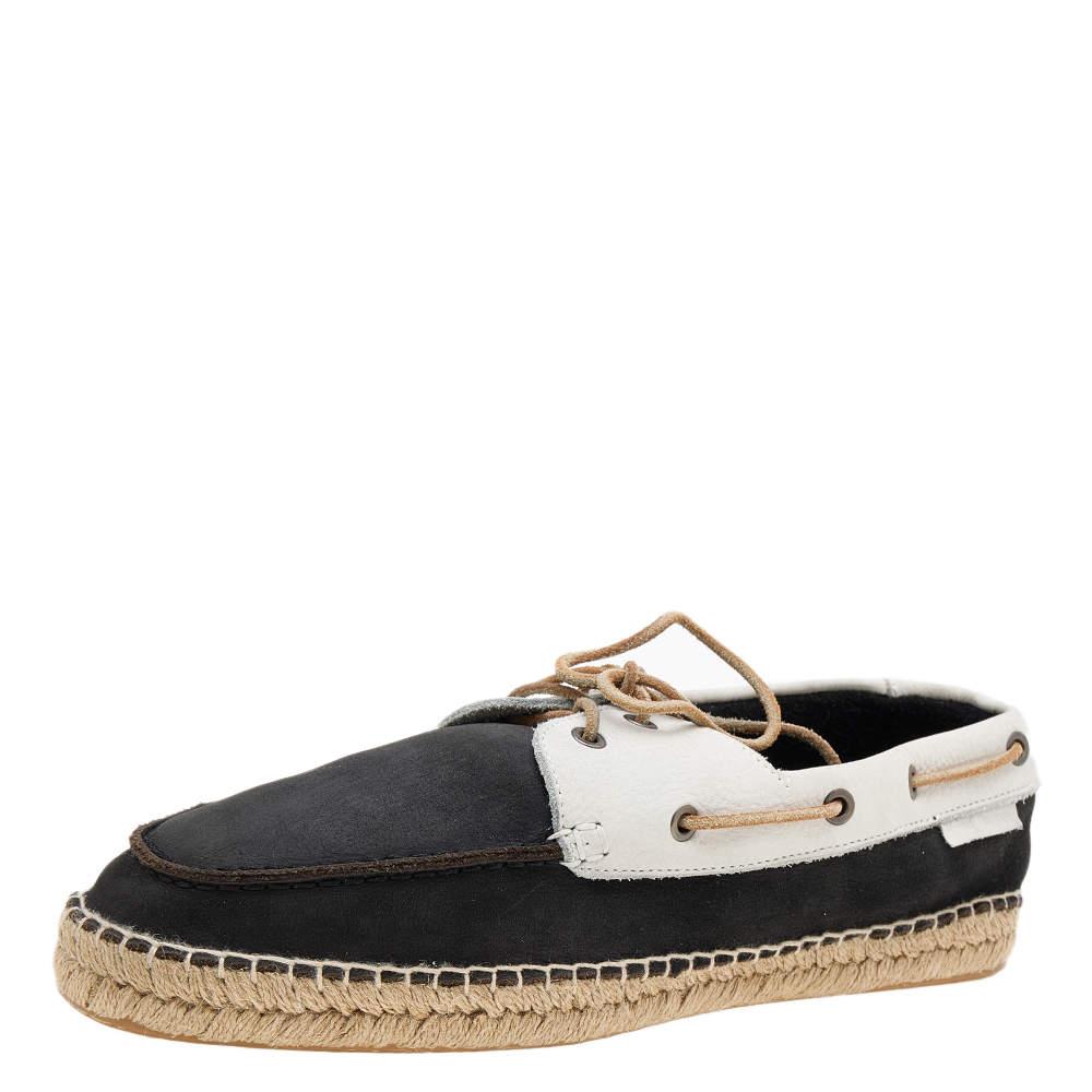 The black and white contrast enhances the appeal of these Giorgio Armani Boat shoes. Exquisitely crafted from nubuck leather on the exterior, they have a braided midsole, lace-up vamp, and silver-tone hardware. The jute insole and rubber sole make