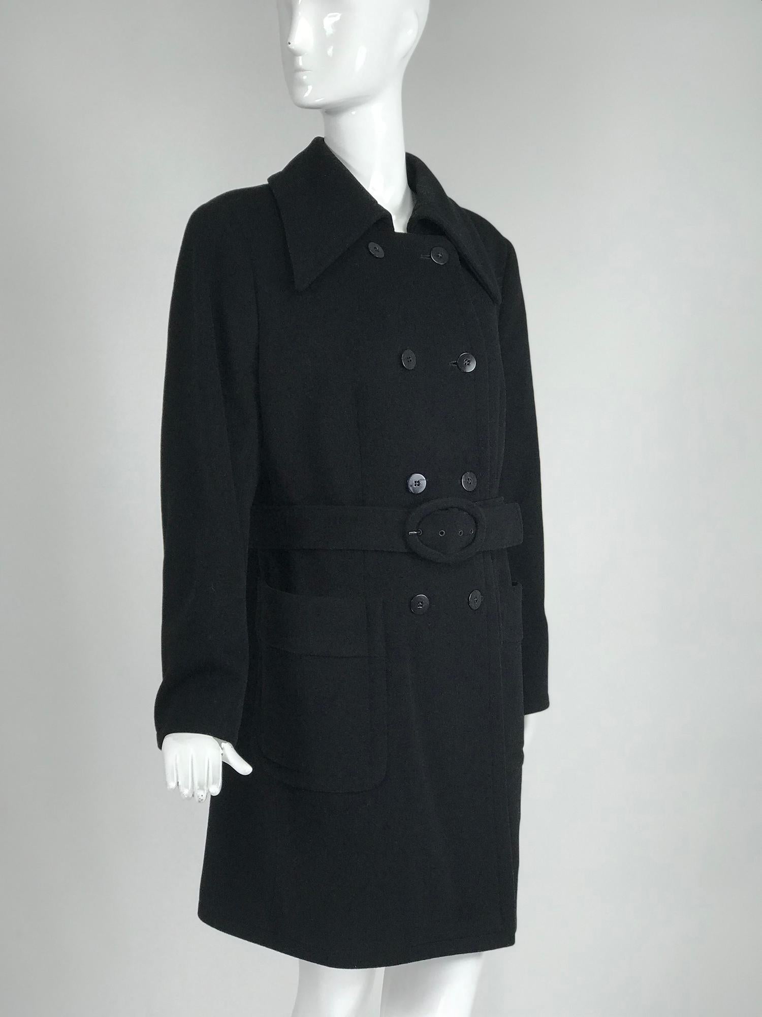 Giorgio Armani black wool double breasted belted coat with deep collar and hit front top stitched patch pockets. This beautiful coat has a self belt, the coat can be worn without the belt. Fully lined in black silky fabric. Princess seams. Center