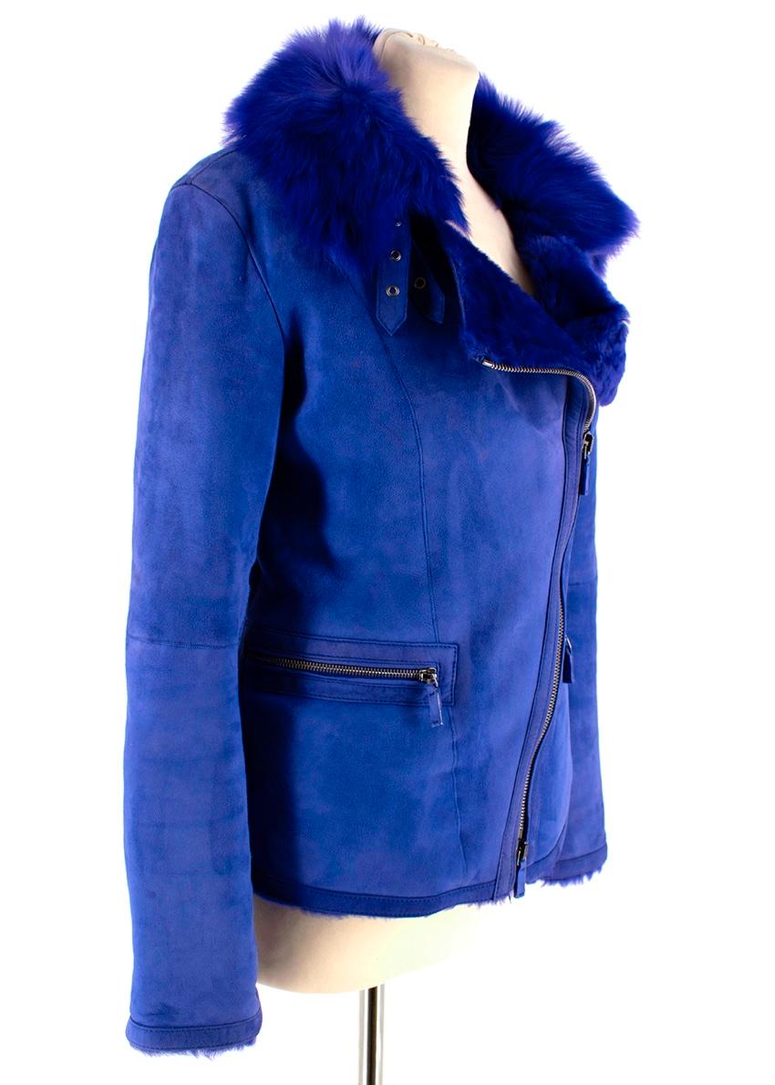 Giorgio Armani Blue Lambs Fur Lined Suede Jacket

- Zip fastening 
- Buckle Detailing 
- Fur Lining 
- Biker Style 
- Mutton Leather 

Made in Turkey 
Measurements are taken laying flat, seam to seam. 

- Shoulders 42 cm 
- Chest 38 cm 
- Length 57