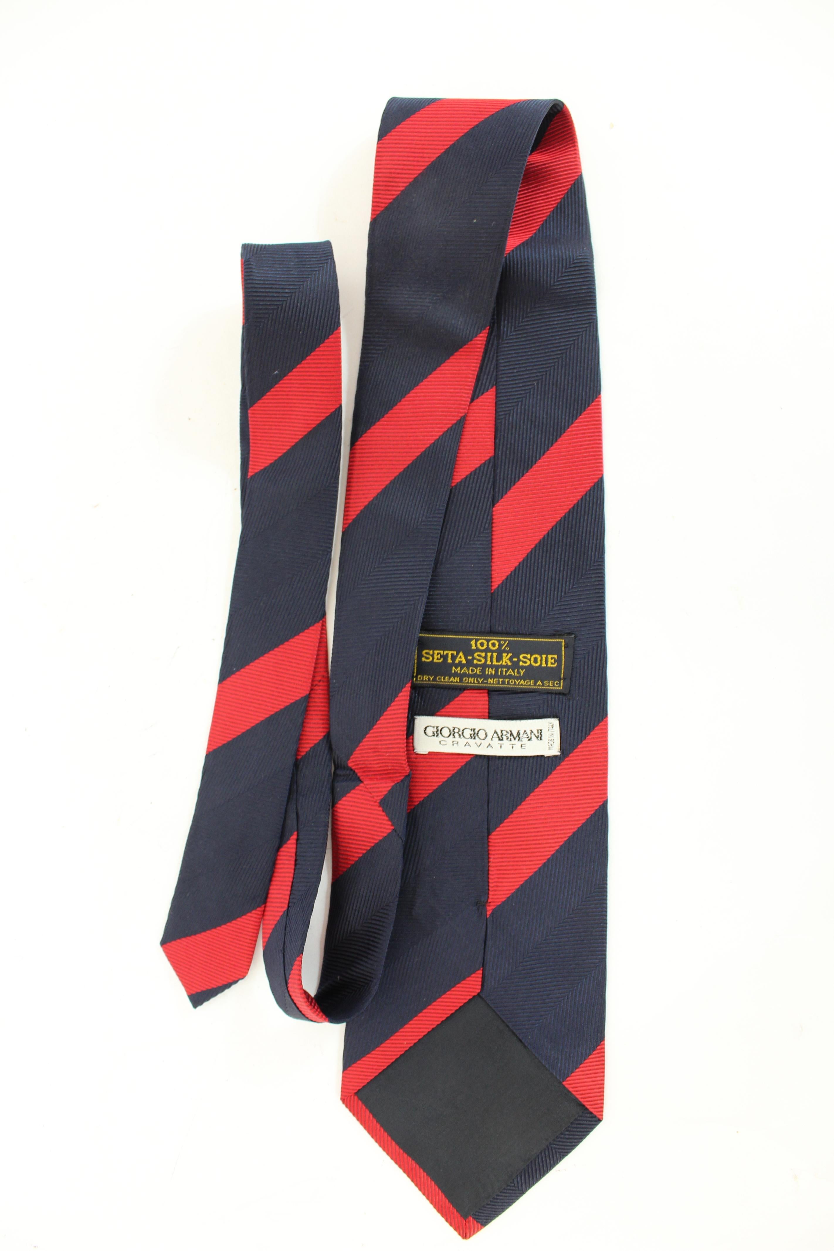 Giorgio Armani vintage 90s tie. Classic tie, regimental pattern. Blue and red color, 100% silk fabric. Made in Italy.

Condition: Excellent

Item used few times, it remains in its excellent condition. There are no visible signs of wear, and it is
