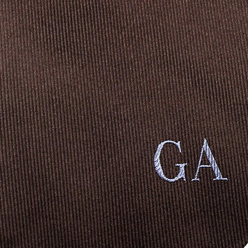 Nothing like statement accessories to help show your love for fashion. Cut from quality silk, this Giorgio Armani tie features a brown shade, contrast diagonal stripes, and GA on the front. This stylish piece is worth the buy.

