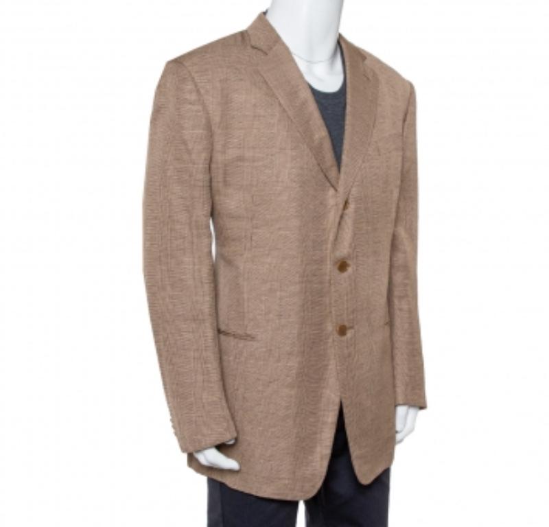 This tailored blazer from Giorgio Armani is sure to make you look your best from every angle. The micro-check blazer is made of a linen blend and features pockets and button front closure. Complement it with a shirt and matching trousers or a simple