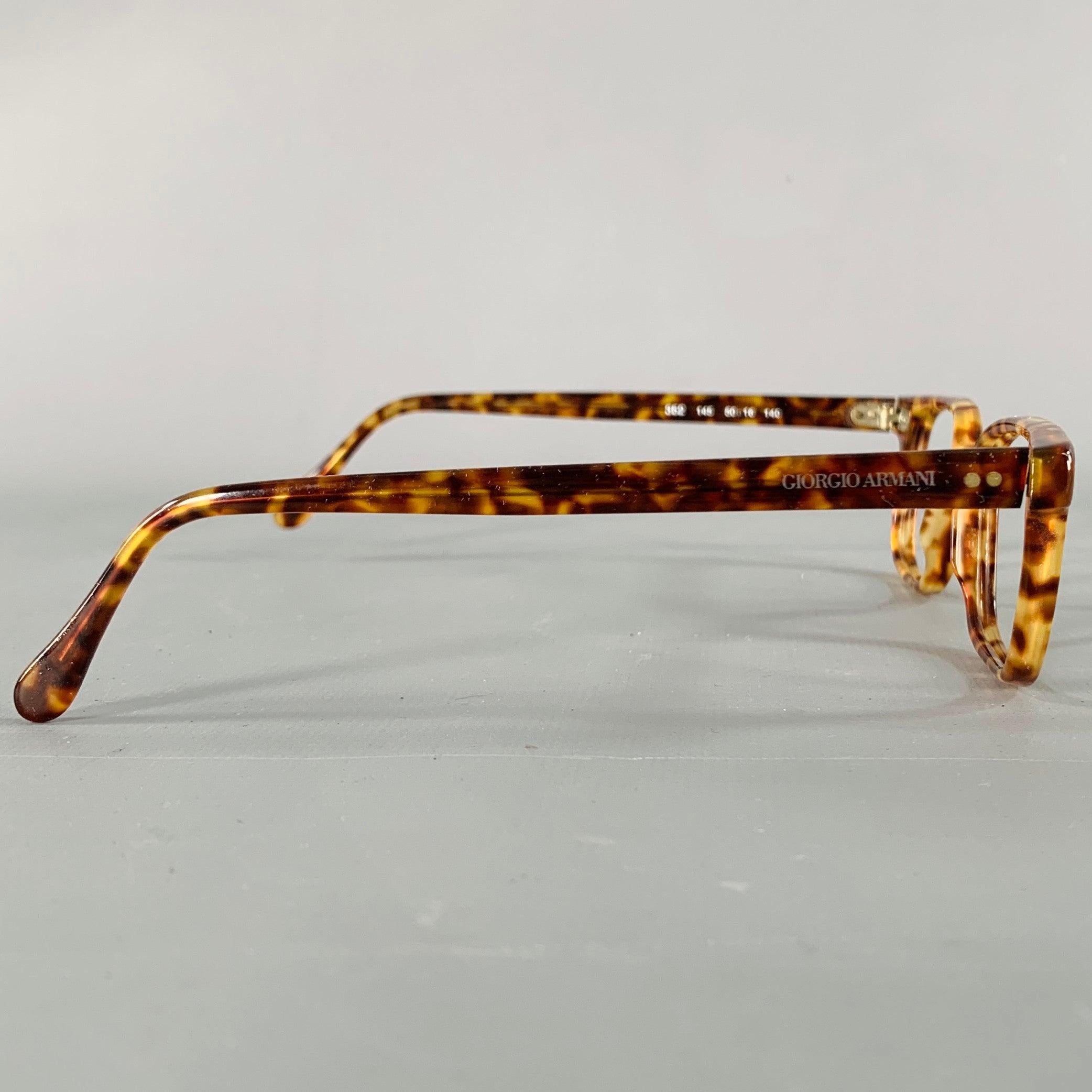 GIORGIO ARMANI frames
in a brown acetate featuring a tortoiseshell pattern. Note: these frames do not contain lenses, and will need to be replaced by an optician. Comes with case. Made in Italy.Excellent Pre-Owned Condition. 

Marked:   352 145 50