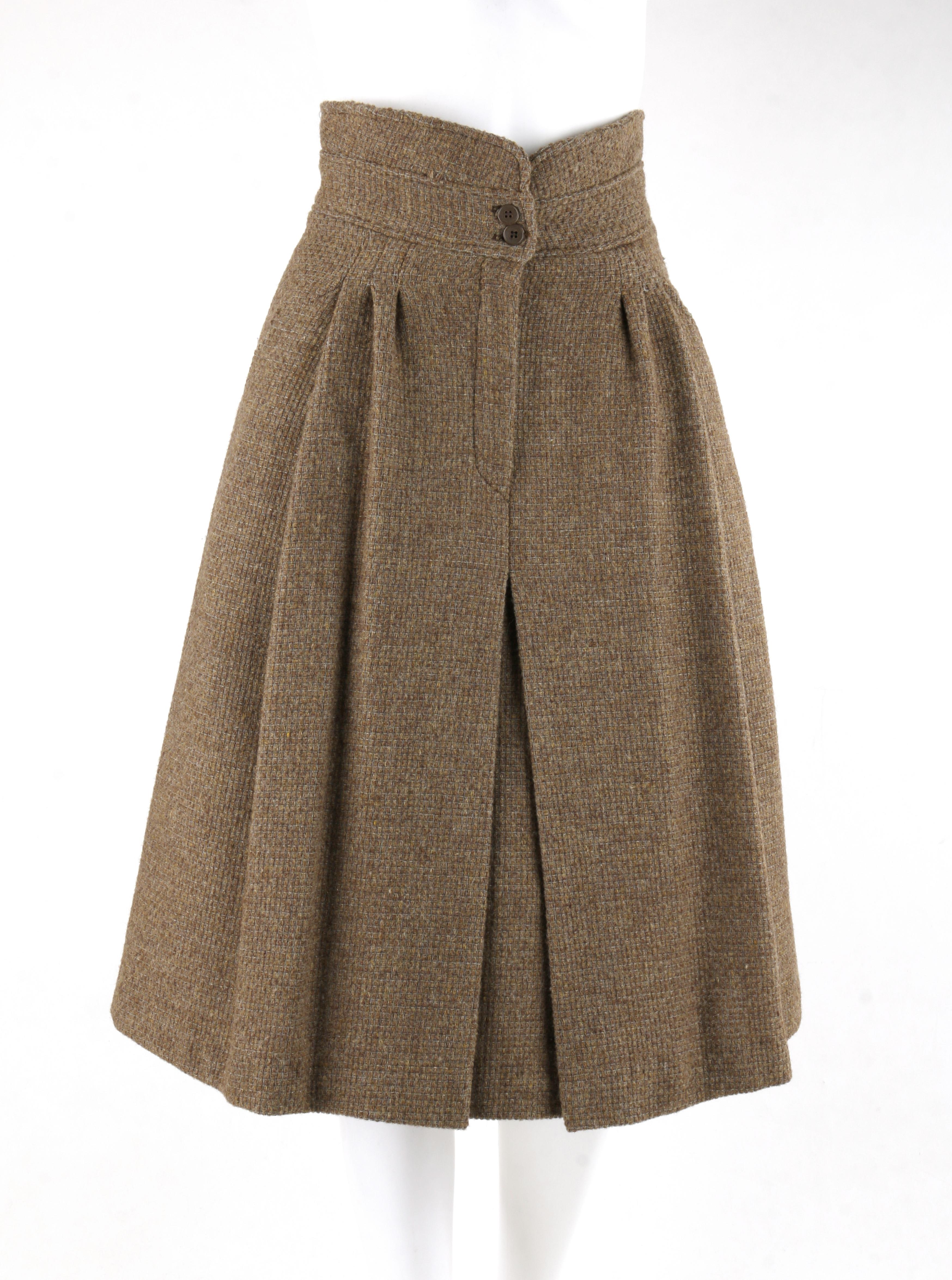 GIORGIO ARMANI c.1980’s Brown Tweed Wool Pleated Fit And Flare A-Line Skirt 
 
Circa: 1980’s 
Label(s): Giorgio Armani   
Designer: Giorgio Armani
Style: Fit & Flare / A-Line
Color(s): Shades of brown and grey
Lined: Yes
Marked Fabric Content: 100%