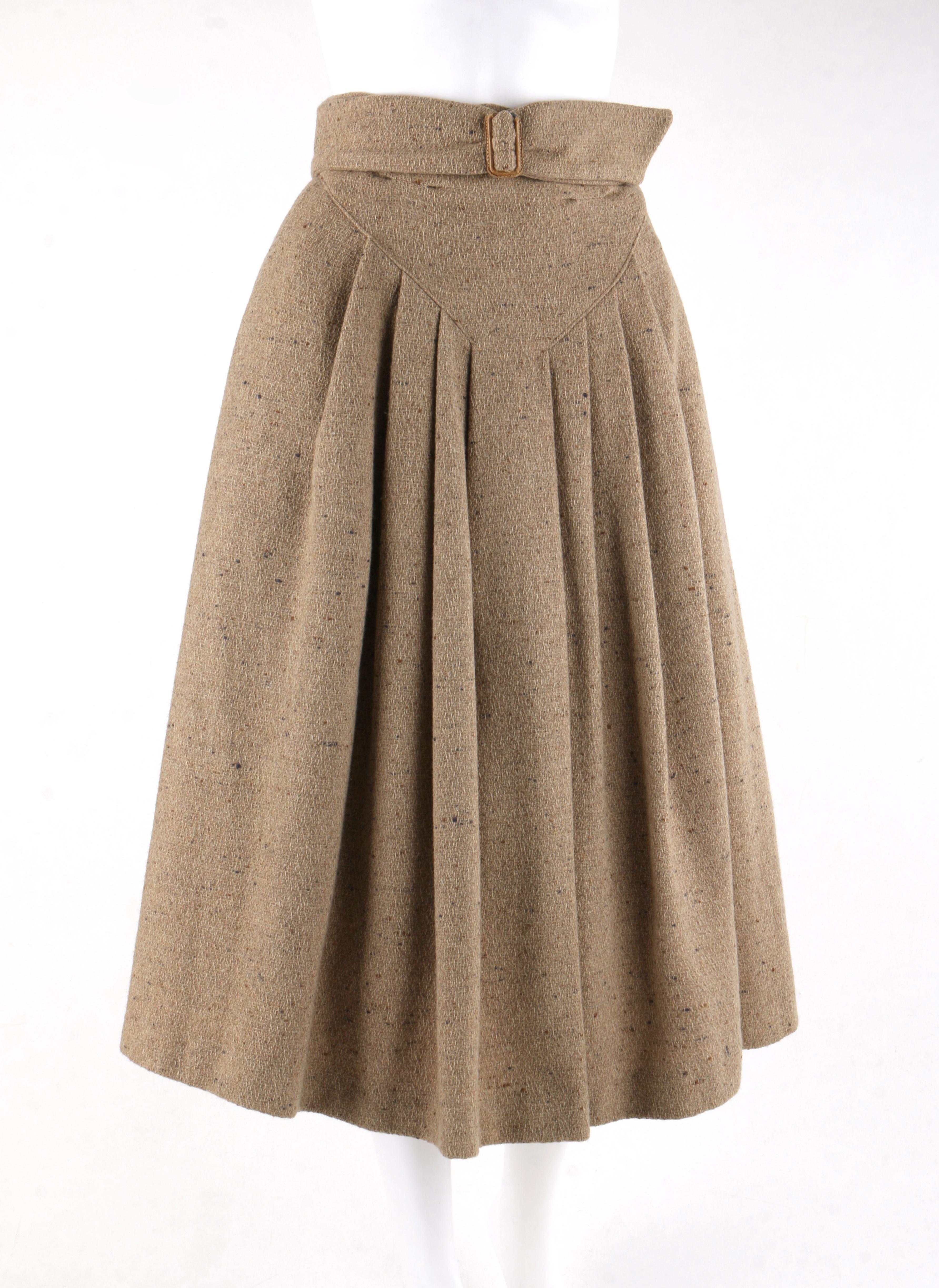 GIORGIO ARMANI c.1980’s Brown Tweed Wool Pleated Wrap Buckle A-Line Skirt
 
Circa: 1980’s
Designer: Giorgio Armani 
Style: Wrap / A-Line Skirt
Color(s): Shades of brown and gray  
Lined: Yes
Marked Fabric Content: 100% Wool 
Additional Details /