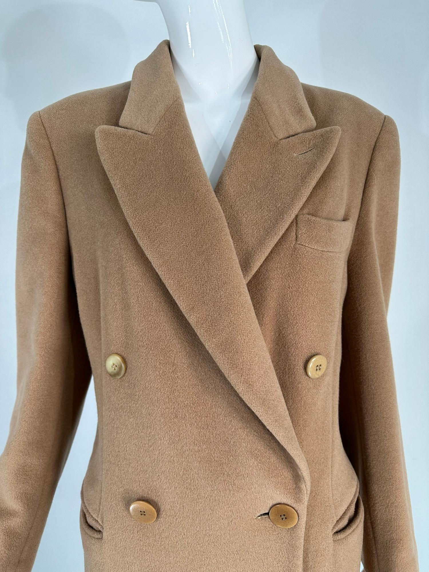 Giorgio Armani camel hair classic double breasted coat from the 1990s. A classic coat with sleek Italian design influences. The coat features notched lapels, double breasted front with single breast pocket & horizontal besom hip pockets. The coat is