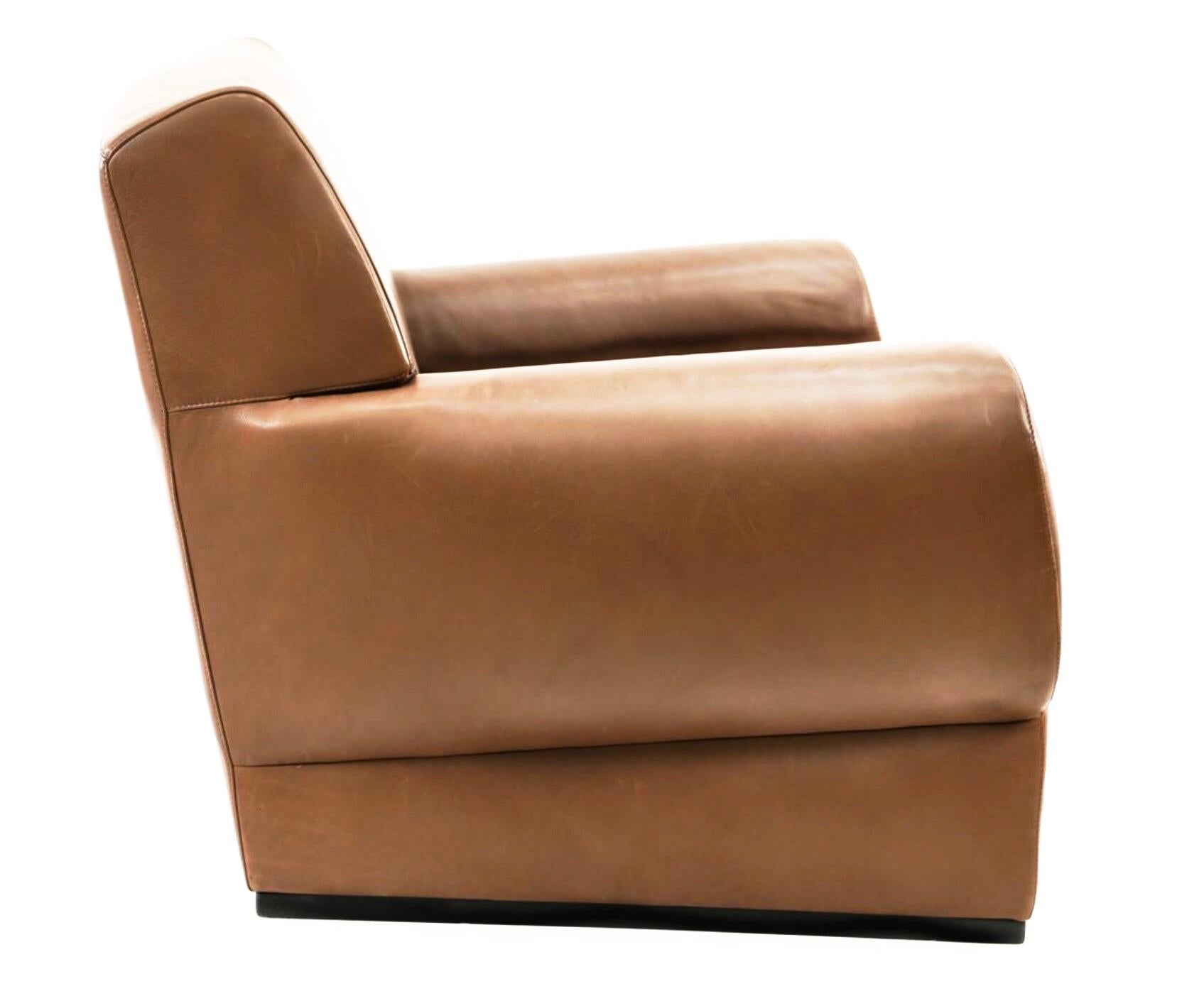 Giorgio Armani Casa brown leather Metropolian club chair. Geometric Deco armchair. Gorgeous, substantial piece, sculptural / geometric form, gorgeous lines. Softed square back and gently rounded arms. Stunning patina. Armani label, circa 2002. MSRP