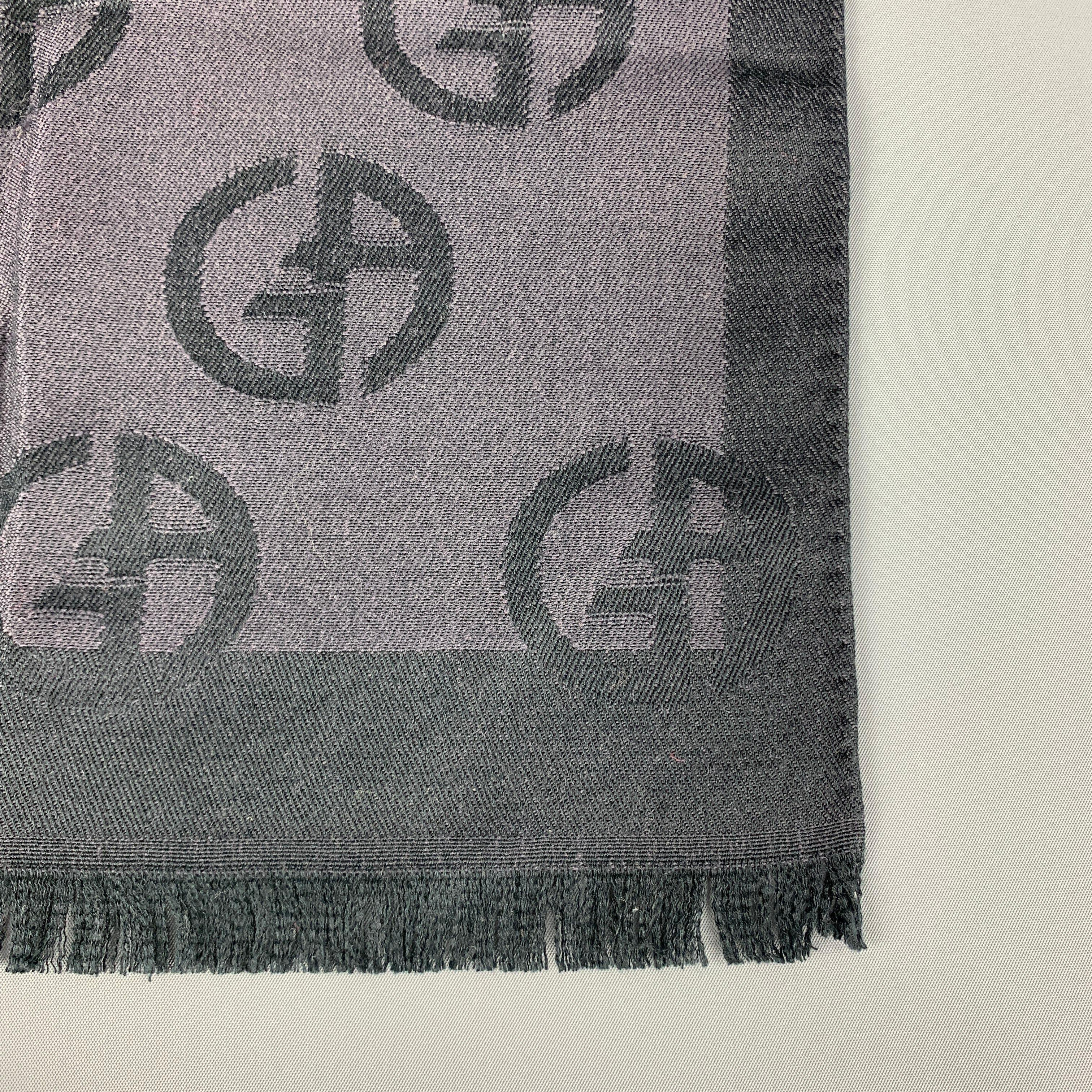 GIORGIO ARMANI Scarf comes in charcoal tones in silk / wool material, with woven monogram throughout and fringe. Made in Italy.
 
Excellent Pre-Owned Condition.
 
70 x 15 in.