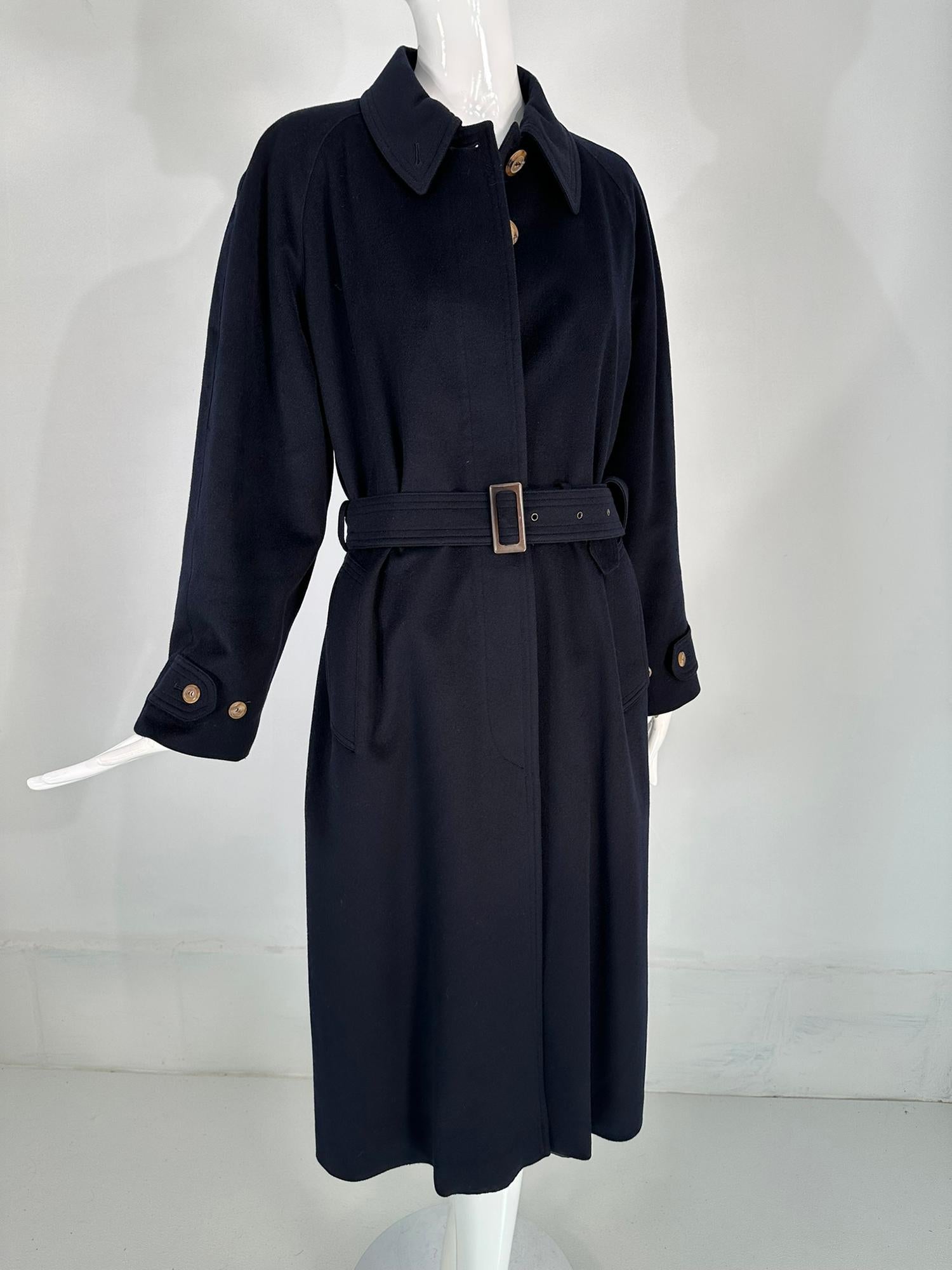 Giorgio Armani Classico, Black Label, navy blue cashmere over coat. Dark navy cashmere coat with tab & adjustable button cuffs, long raglan sleeves. The coat closes at the front with a placket & hidden buttons to the neck. There are shaped flange