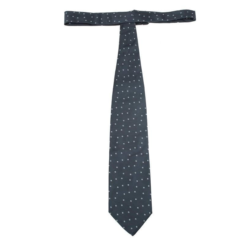 Impress everyone with a sophisticated style statement at work. This Giorgio Armani tie comes crafted in dark grey silk and looks catchy in dotted design. Wear this with a business suit for that head-turning style.

