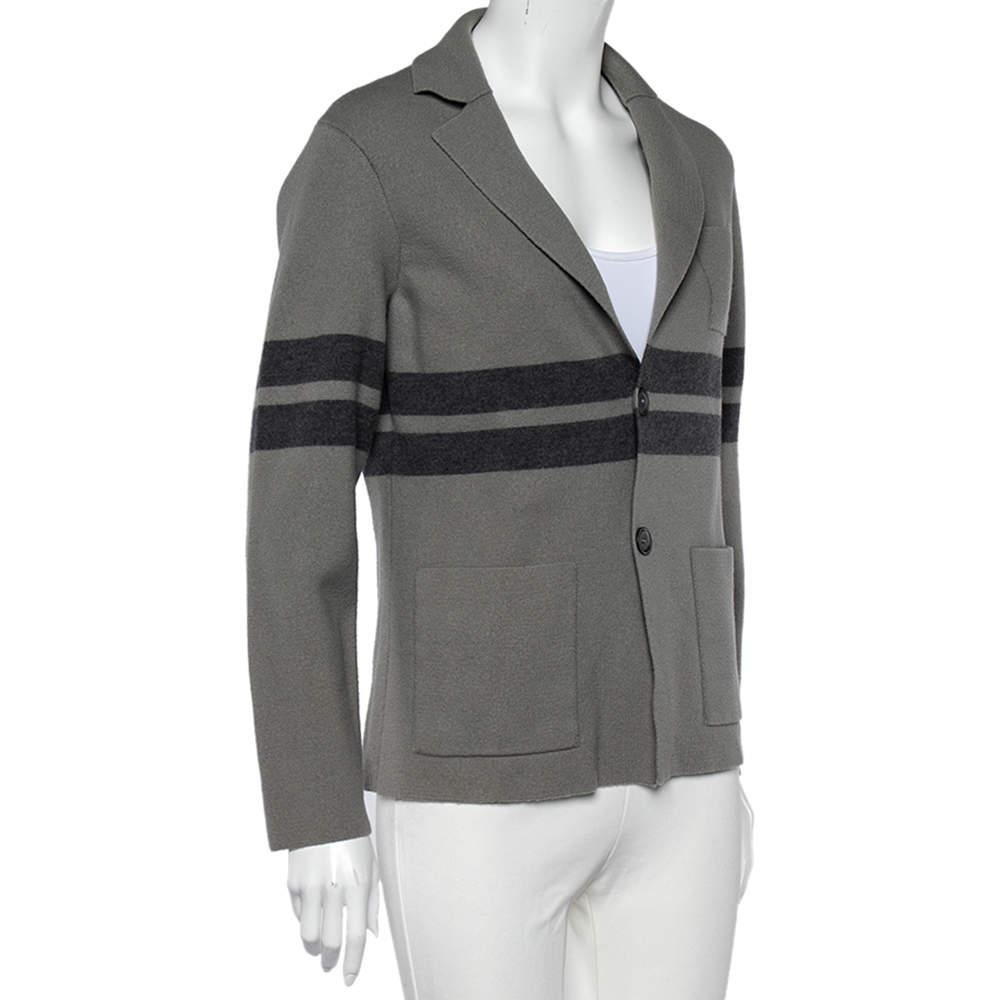 Get a refined and magnificent appearance by wearing this cardigan from Giorgio Armani. It is made using grey wool with a contrast stripe and button front detail adorning its silhouette. This winter, look nothing but polished and classy as you wear