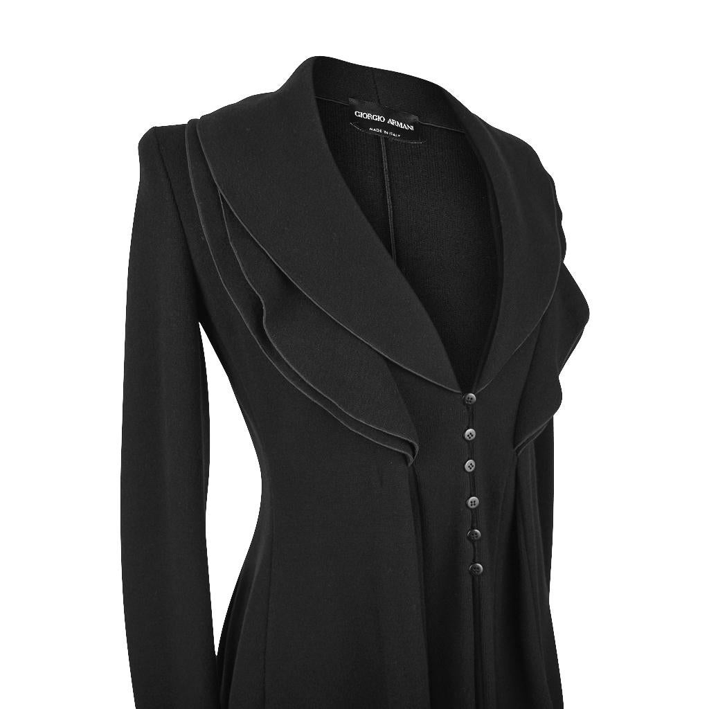 Guaranteed authentic Giorgio Armani  Black Label exquisitely shaped Black jacket.  
Shawl collar has 3 layers edged in black piping.
Hidden closure with 6 small buttons down center of jacket.
Beautifully shaped for a divine fit open or