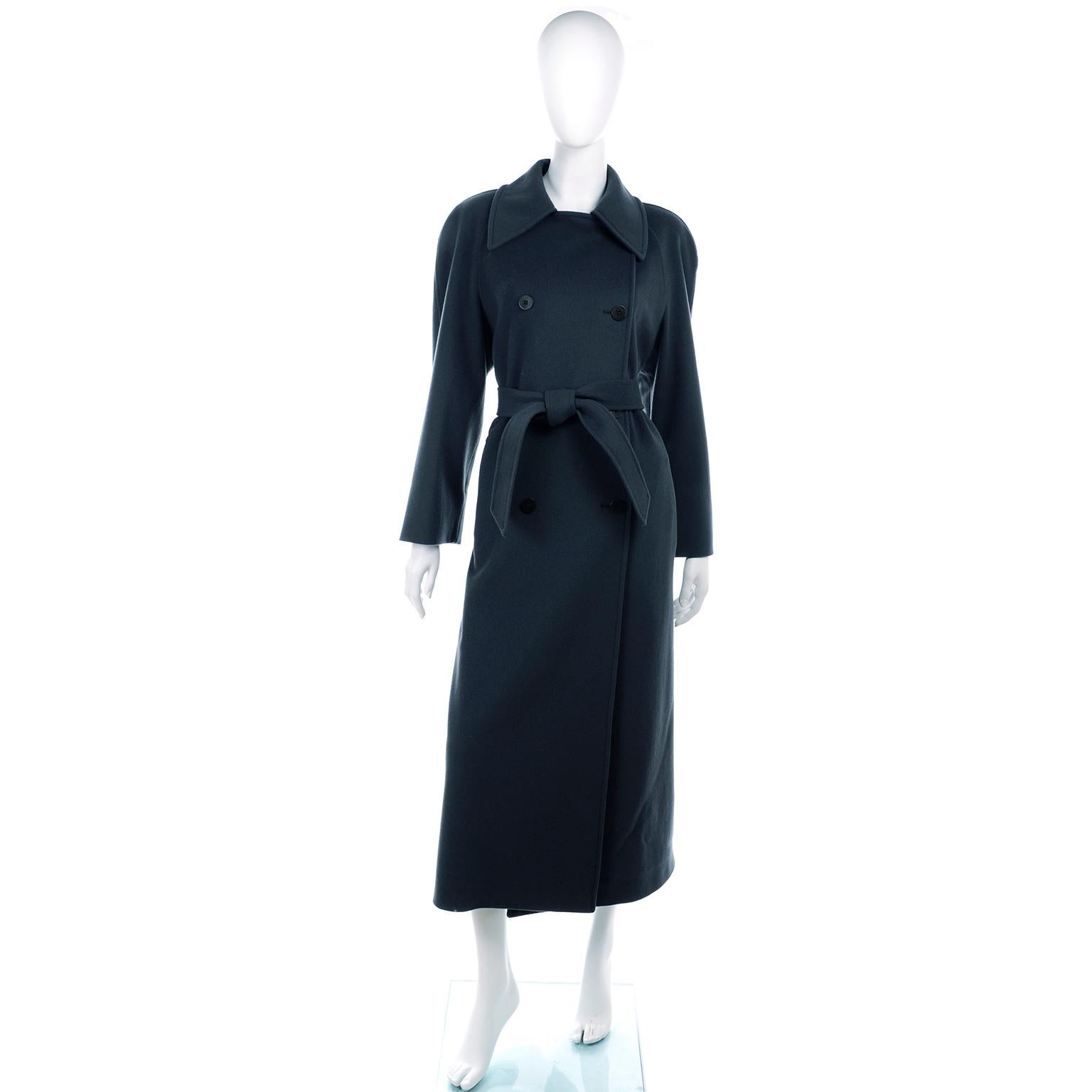 This is a beautiful Giorgio Armani Le Collezioni pure wool double breasted vintage coat with belt. The wool fabric is a deep green/gray and the coat is full lined. Perfect for cold weather, this coat has a wonderful weight to it. 

This lovely coat