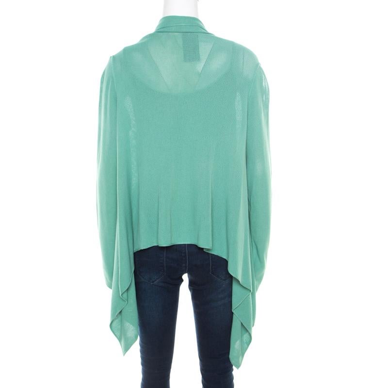 This mint green top set from Giorgio Armani is gorgeous! It comes with a cardigan that matches the top. The top is sleeveless and the cardigan has an open front and long sleeves. You can wear it with jeans and high heel sandals.

