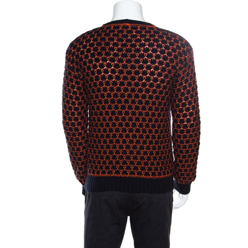 Plush and warm, this sweater by Giorgio Armani is one creation that will brighten your chilly days. Luxuriously made from a blend of finest fabrics, this piece is accentuated with long sleeves, a crew neck, and a combination of navy blue and orange
