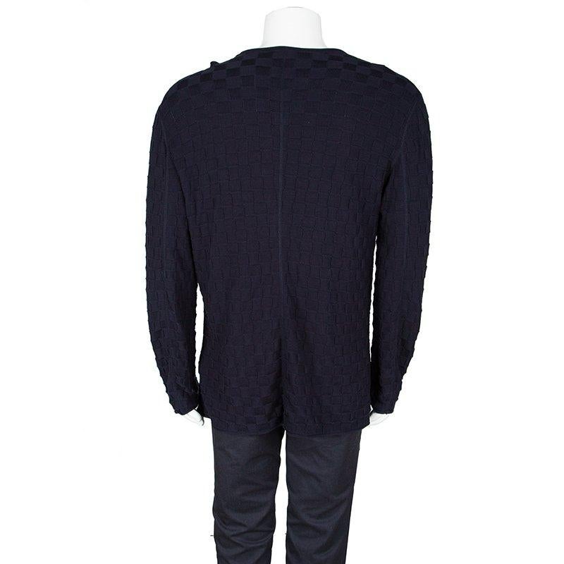 Luxuriously made from cotton in Italy, this Giorgio Armani cardigan is a keeper. It carries a navy blue shade with long sleeves and basketweave patterns all over. Simple yet stylish, this cardigan will be a smart wardrobe addition.

Includes: The