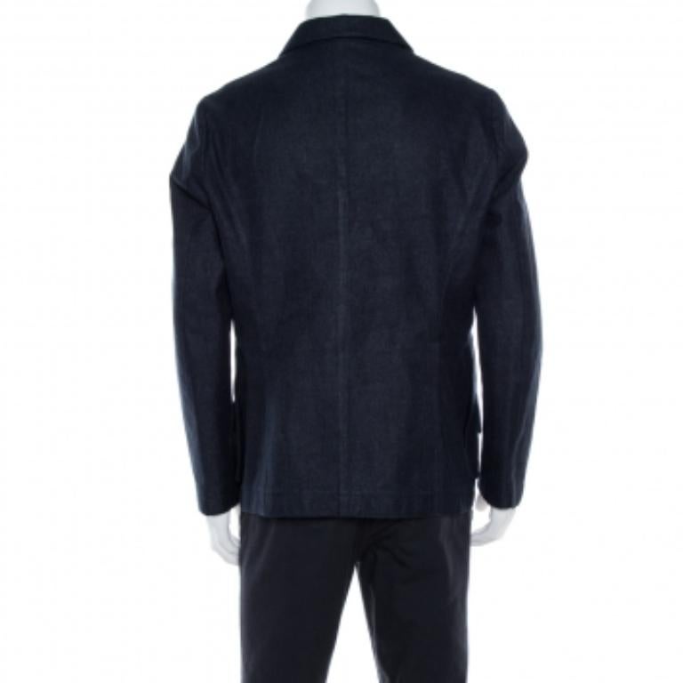 Nothing gives you a better style than a well-tailored jacket. This creation by Giorgio Armani is cut from navy blue linen & wool. It features a notched collar and three buttoned front closure. It is enhanced with two pockets. This jacket will be