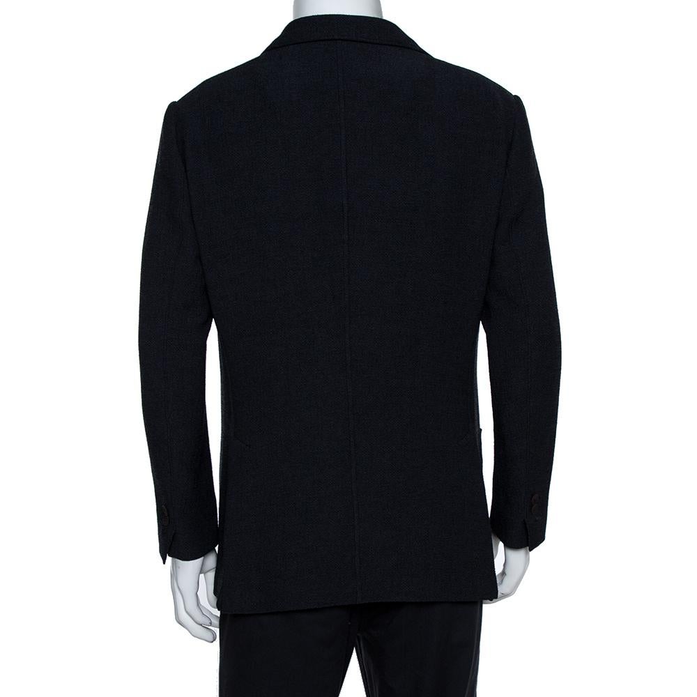 Give your formal look a stunning fashion update with this impressive jacket from Giorgio Armani. Designed flawlessly, it features a subtle navy blue body crafted from a durable fabric blend. The jacket, fashioned in a double-breasted style, offers a