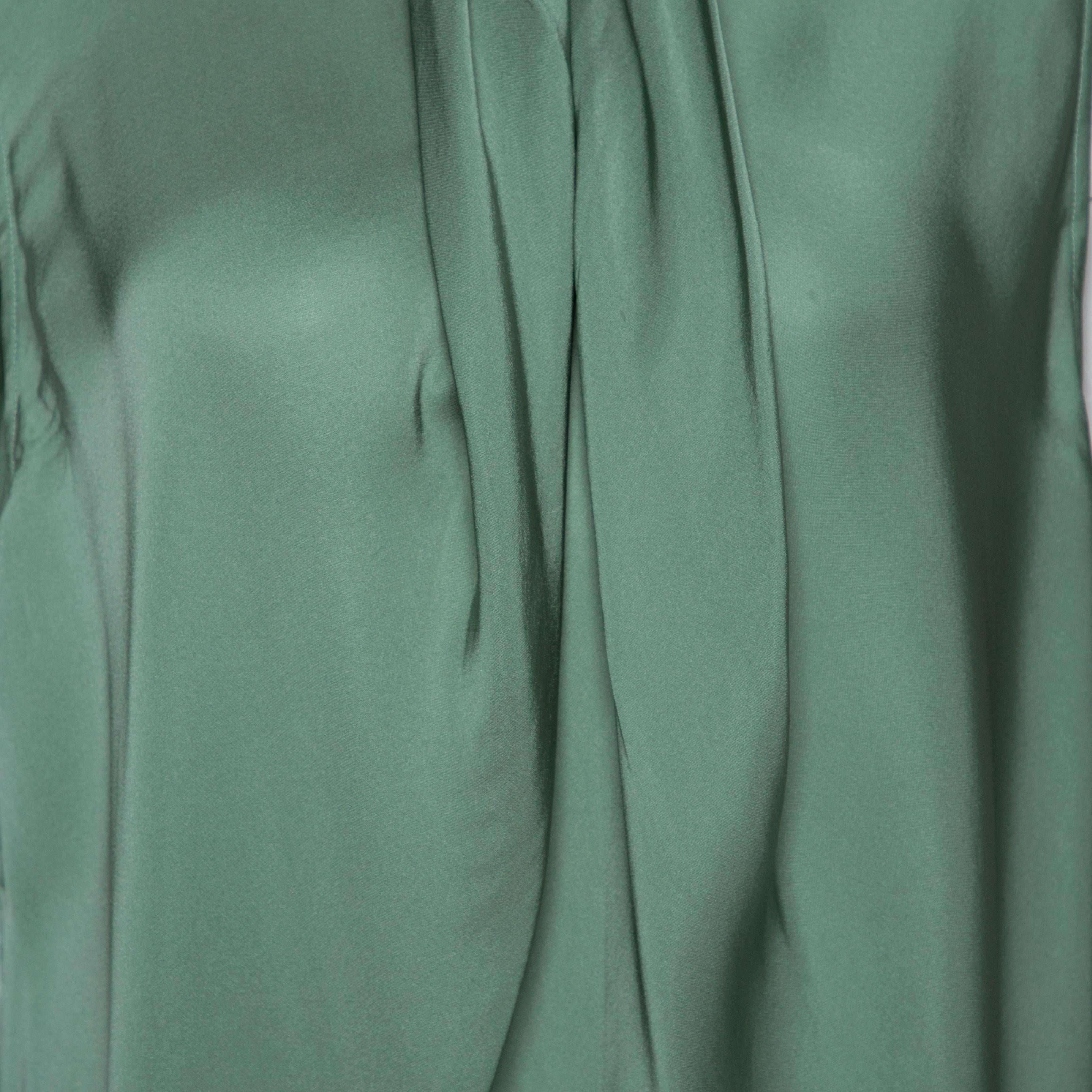 green sleeveless blouse