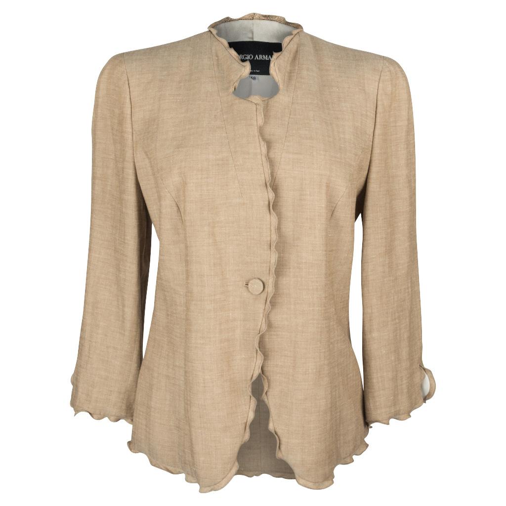 Guaranteed authentic Giorgio Armani pant suit Divine in wonderful toasted camel with a very subtle herringbone.
The jacket is edged in a wonderful, small 'undulating' ruffle. 
One button single breast with a 3/4 sleeve.
Flat front trouser with two