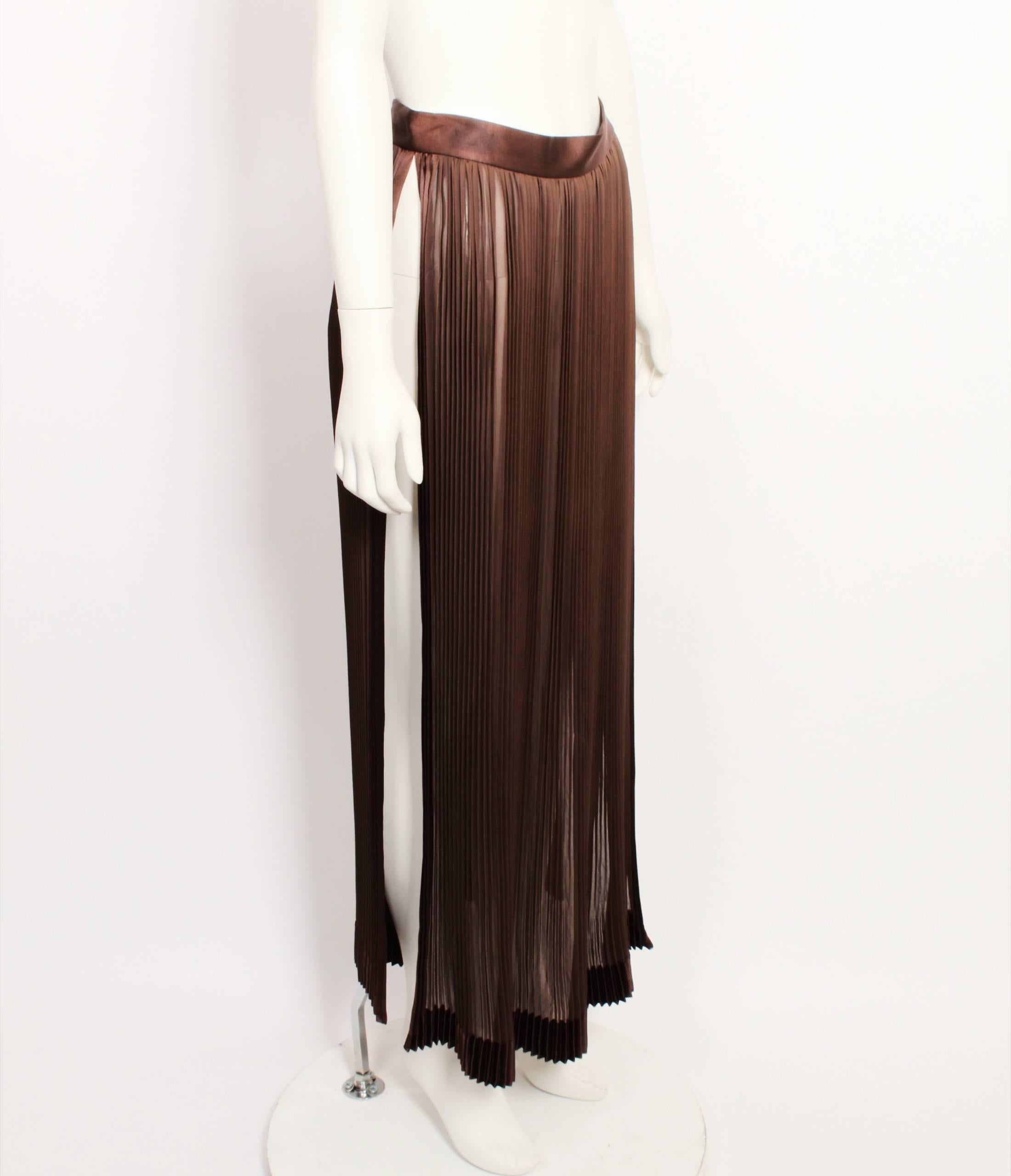 - Chocolate Brown Silk Pleated Skirt. 
- Thigh High Split up leg on both sides of skirt.
- Single button fastener on left hand-side. 