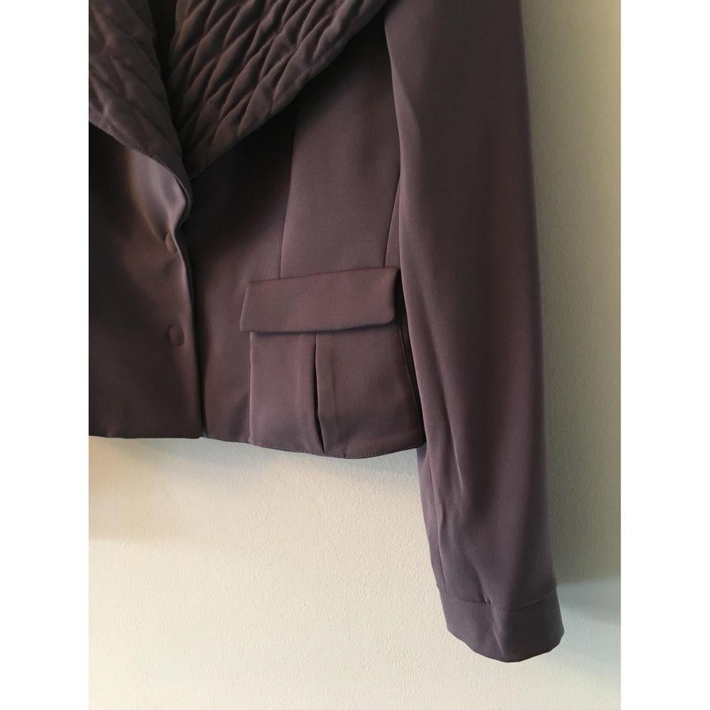 Giorgio Armani Polyester Suit in Purple

Giorgio Armani suit. Crafted in wisteria-colored polyester. Size 42 it. 
 The jacket measures 42 cm in the shoulders, 44 cm in the bust, 60 cm in length and 65 cm in the sleeves. 
 The trousers measure 38 cm