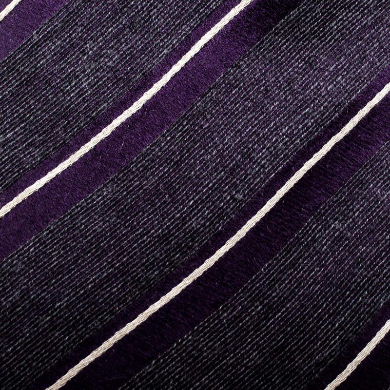This suave silk wool tie from Giorgio Armani is perfect for the handsome you. Designed with diagonal stripes, this purple tie comes with the label and a keeper loop on the back. Wear this to your most important meetings and you are sure to be the