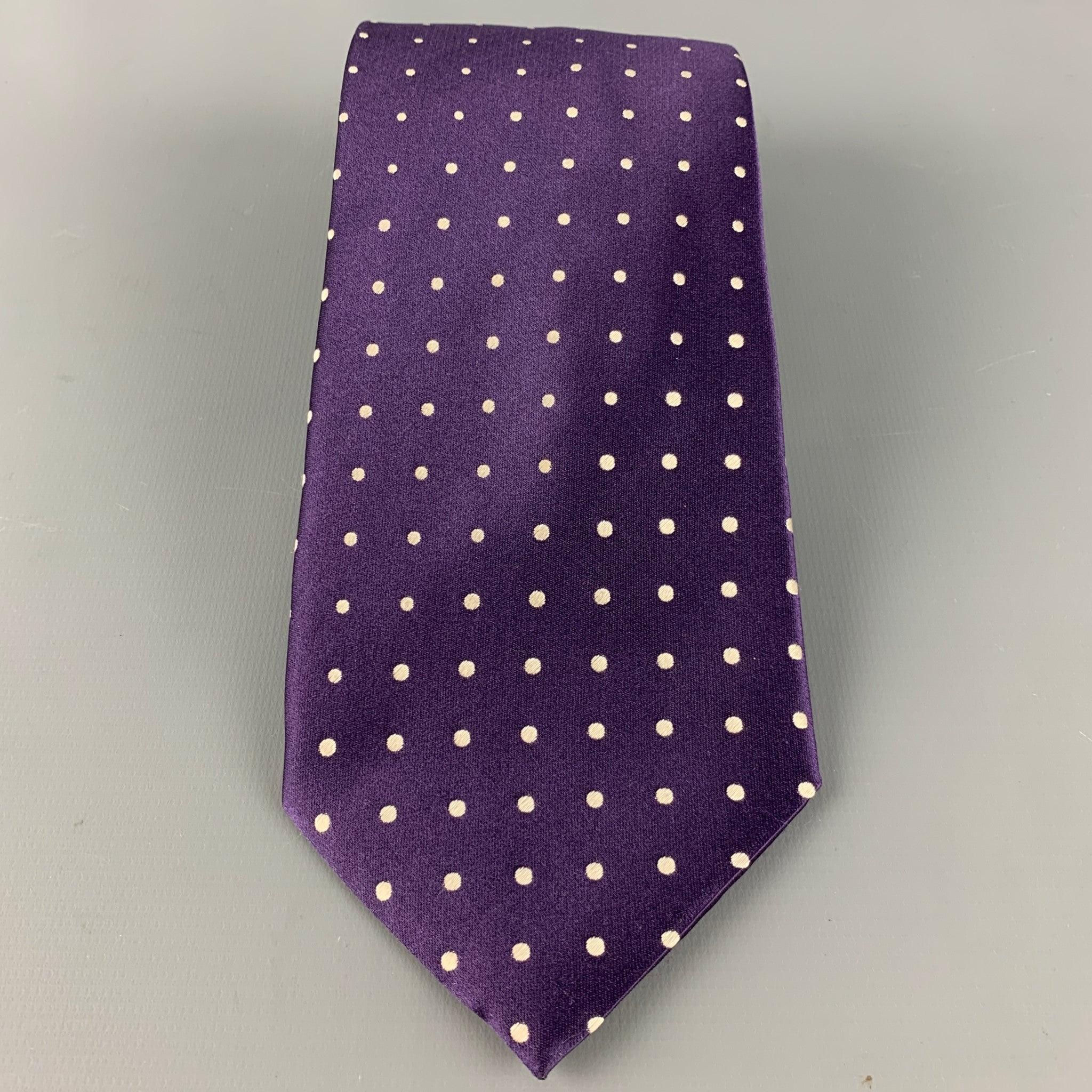 GIORGIO ARMANI tie in purple silk satin, featuring an all over white dots pattern. Handmade in Italy.Very Good Pre-Owned Condition. 

Measurements: 
  Width: 4 inches Length: 62 inches 
  
  
 
Reference: 126584
Category: Tie
More Details
   