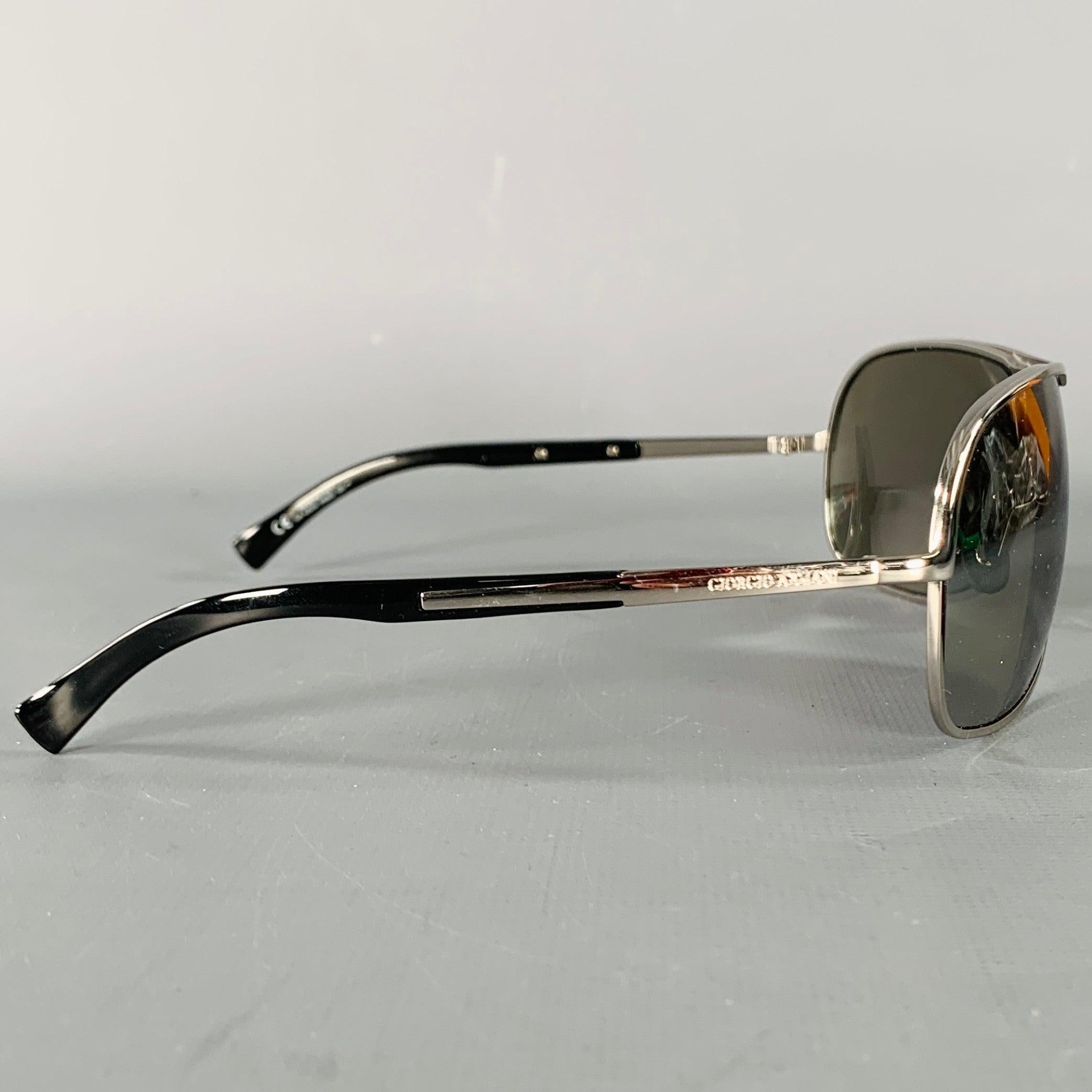 GIORGIO ARMANI sunglasses
in a silver tone metal featuring a shield style, black acetate temple arm accents, and mirrored lenses. Comes with case and certificate of authenticity. Made in Italy.Very Good Pre-Owned Condition.  

Marked:   GA 435/S