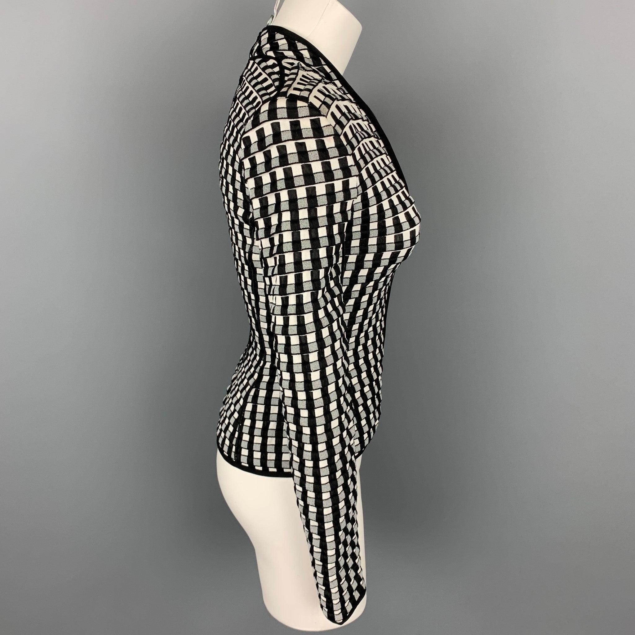 GIORGIO ARMANI jacket comes in a black & white textured viscose blend featuring no collar and a zip up closure. Moderate wear.Good
Pre-Owned Condition. 

Marked:   36 

Measurements: 
 
Shoulder: 15 inches  Bust: 32 inches  Waist: 26 inches 