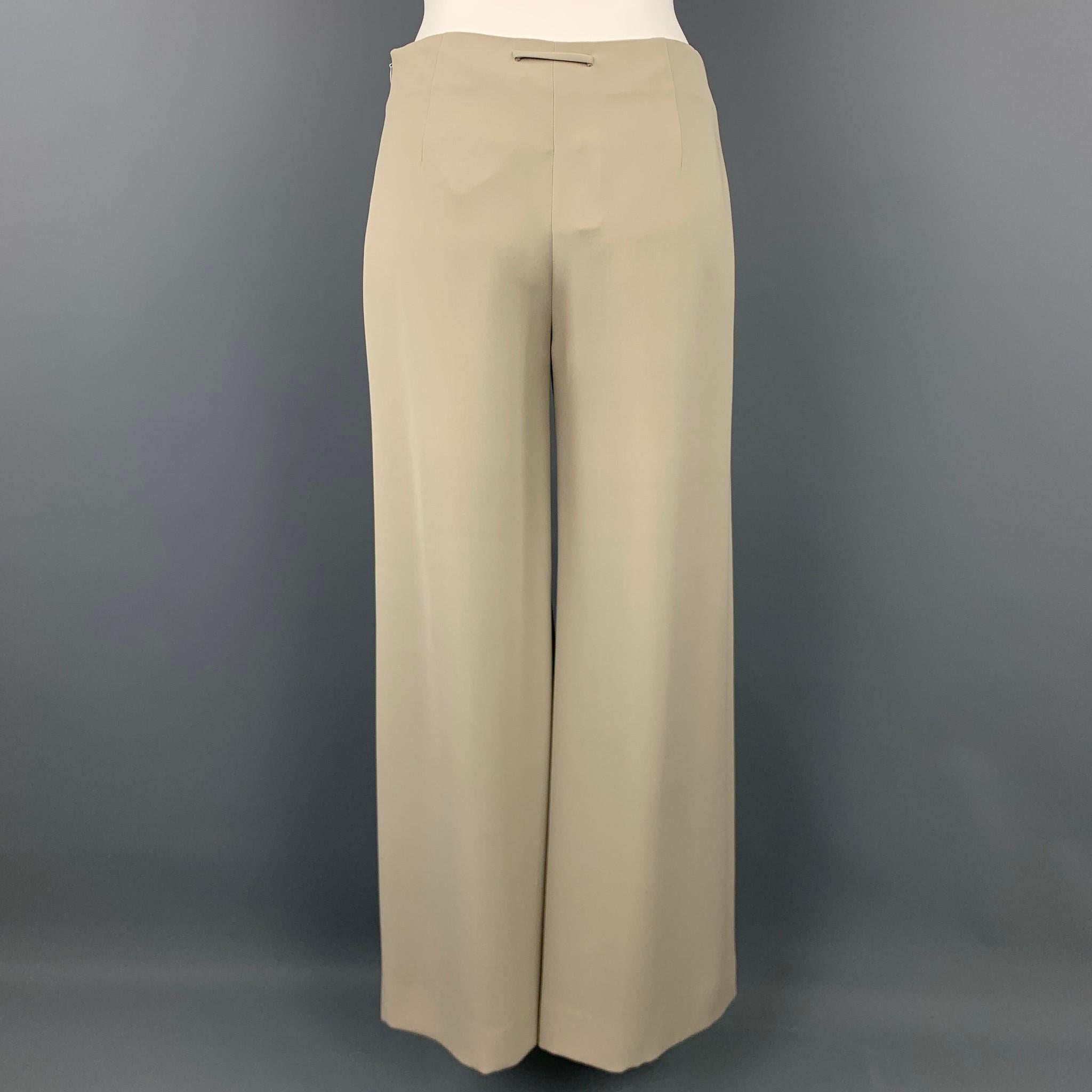 GIORGIO ARMANI dress pants comes in a grey silk featuring a wide leg style and a side zip up closure. Comes with tags. Made in Italy.

Very Good Pre-Owned Condition.
Marked: IT 36
Original Retail Price: $734.00

Measurements:

Waist: 28 in.
Rise: