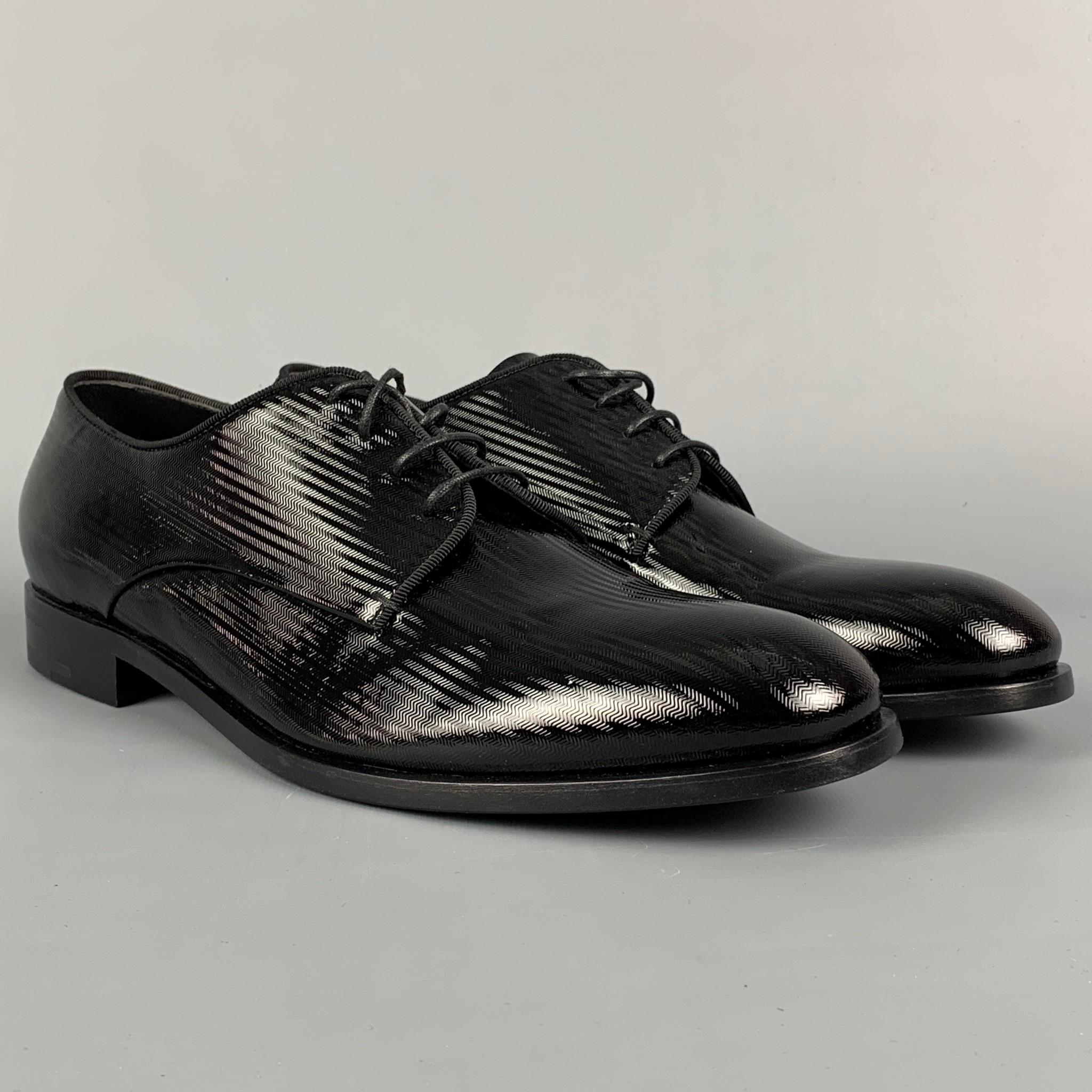 GIORGIO ARMANI shoes comes in a black herringbone leather featuring a round toe and a lace up closure. Includes box. Made in Italy. 

Excellent Pre-Owned Condition.
Marked: 9
Original Retail Price: $895.00

Outsole: 12 in. x 4 in. 