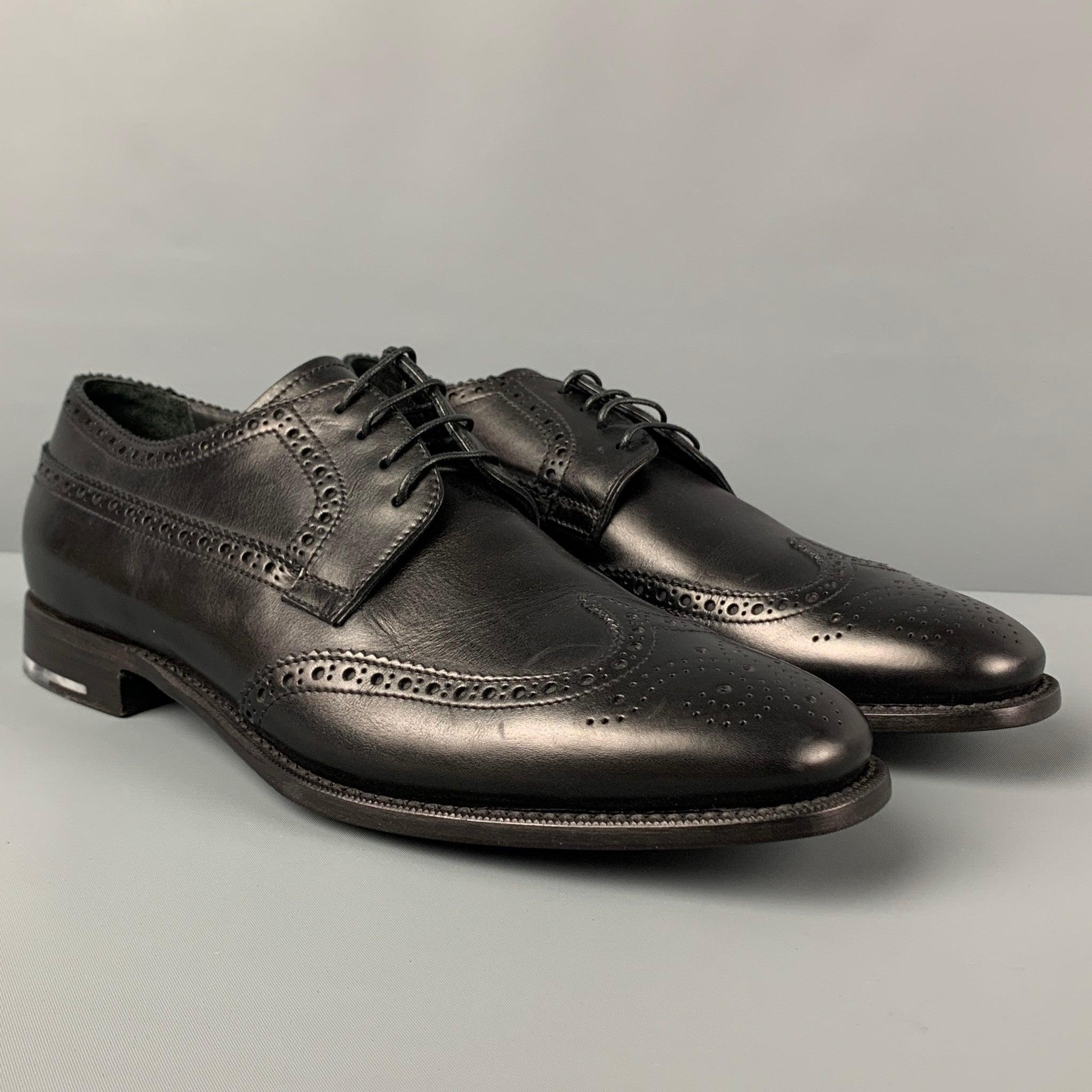 GIORGIO ARMANI shoes comes in a black perforated leather featuring a wingtip style and a lace up closure. Includes box.
Very Good
Pre-Owned Condition. 

Marked:  
9Outsole: 12.25 inches  x 4.25 inches 
  
  
 
Reference: 119935
Category: Lace Up