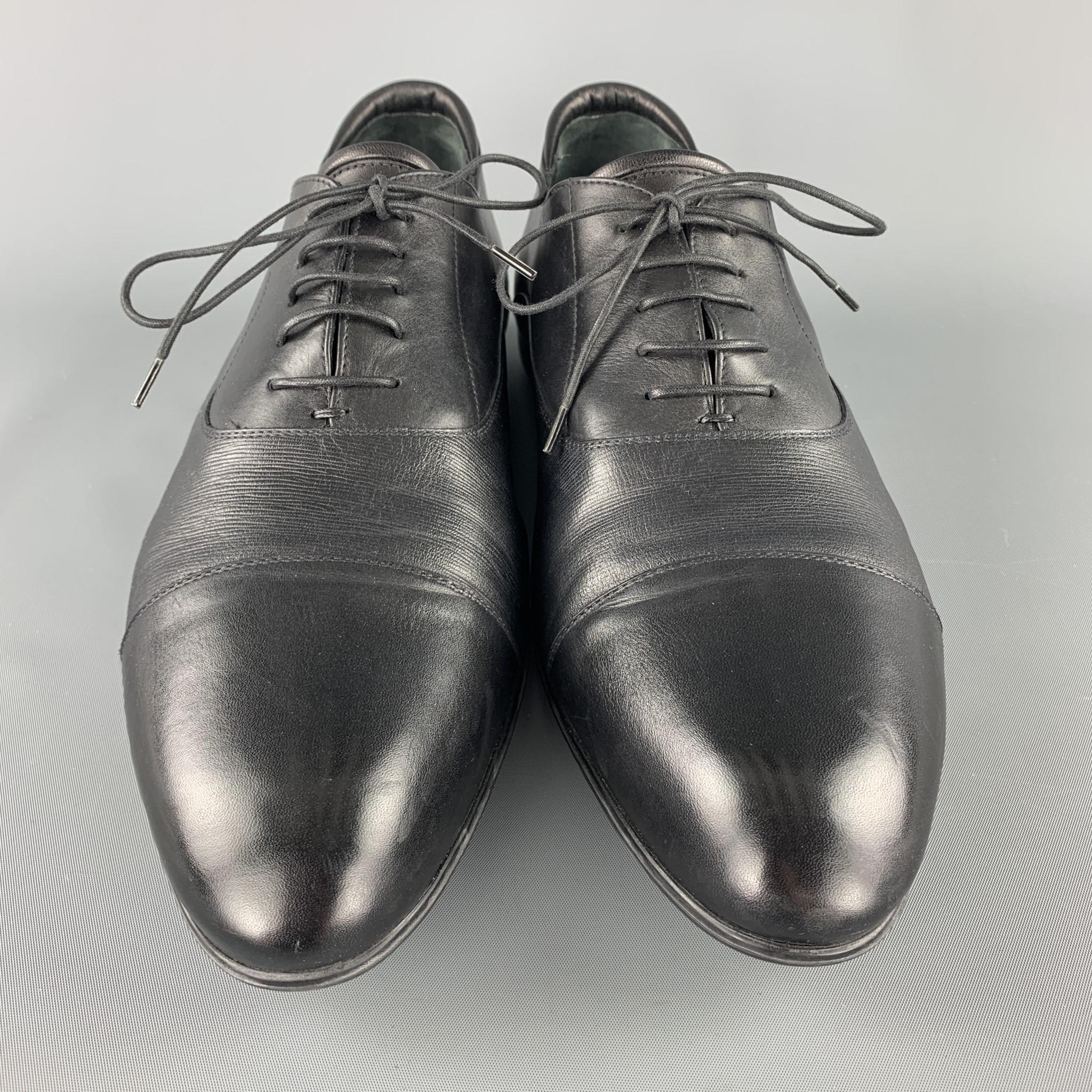 GIORGIO ARMANI dress shoes come n smooth leather with a cap toe, rubber sole, and textured mid section. With box. Made in Italy.

Excellent Pre-Owned Condition.
Marked: IT 43

Outsole: 12.25 x 4 in.
SKU: 104011
Category: Lace Up

More Details
Size: