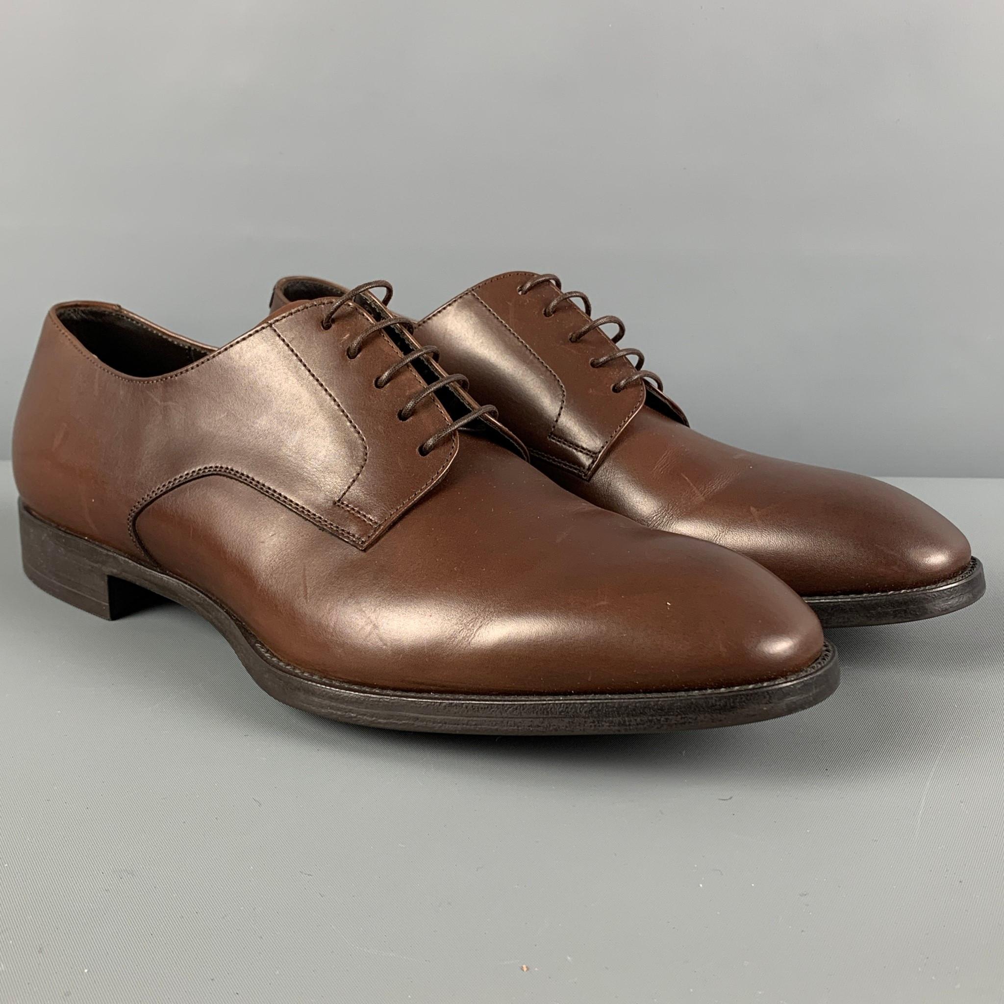 GIORGIO ARMANI shoes comes in a brown leather featuring a classic style and a lace up closure. Made in Italy. 

Very Good Pre-Owned Condition.
Marked: X2C536 9

Outsole: 12 in. x 4.25 in.