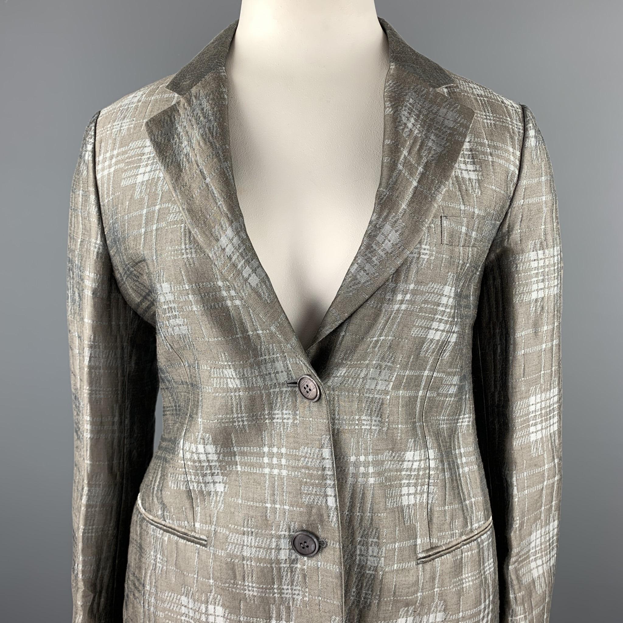 GIORGIO ARMANI blazer comes in a grey plaid jacquard linen blend with a half stripe liner featuring a notch lapel, slit pockets, and a two button closure. Made in Italy.

Excellent Pre-Owned Condition.
Marked: IT 46

Measurements:

Shoulder: 16.5