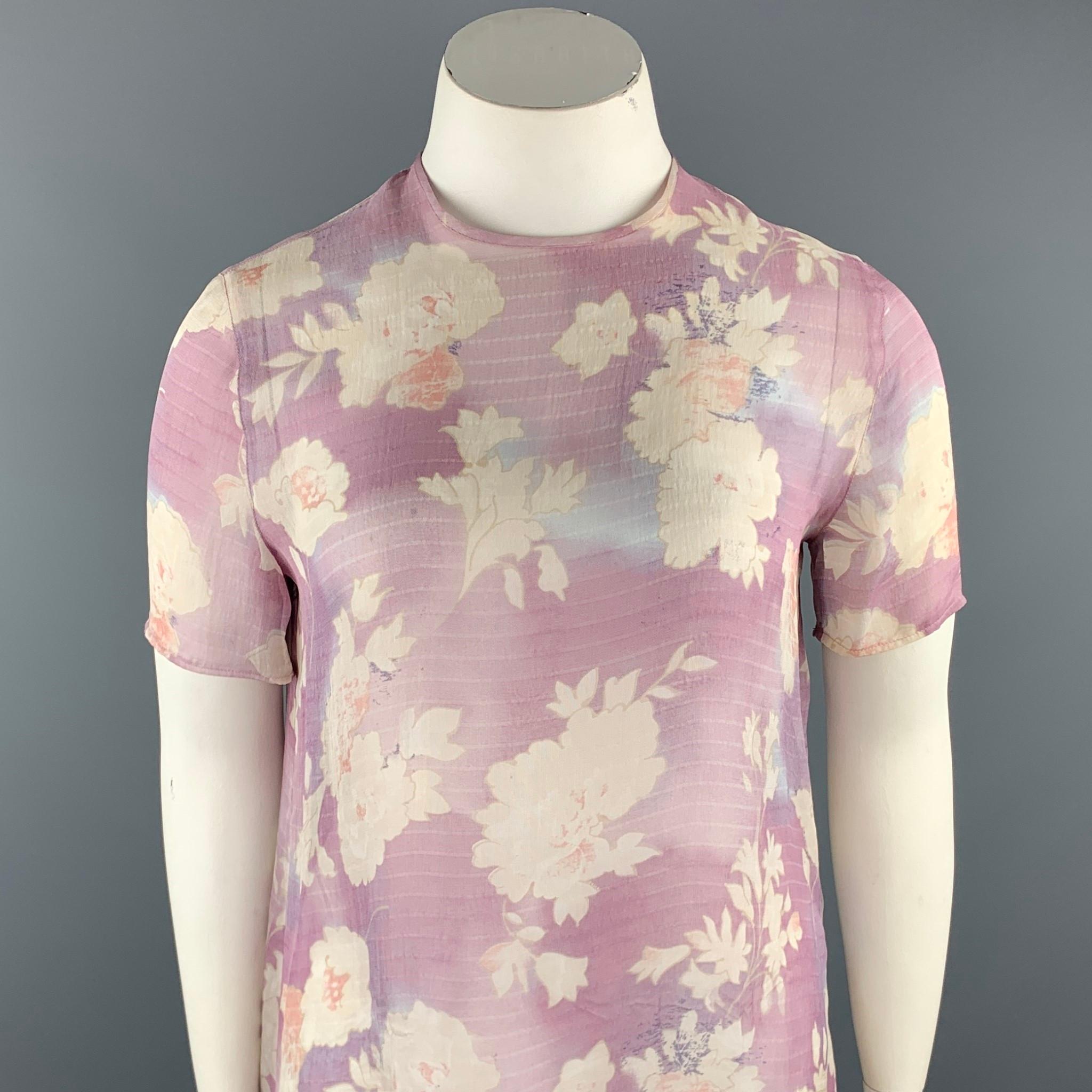GIORGIO ARMANI T shirt blouse comes in light purple floral chiffon with shorts sleeves. Made in Italy.

Very Good Pre-Owned Condition.
Marked: US 10

Measurements:

Shoulder: 16 in.
Chest: 42 in.
Sleeve: 8.5 in.
Length: 26 in.
SKU: 94309
Category: