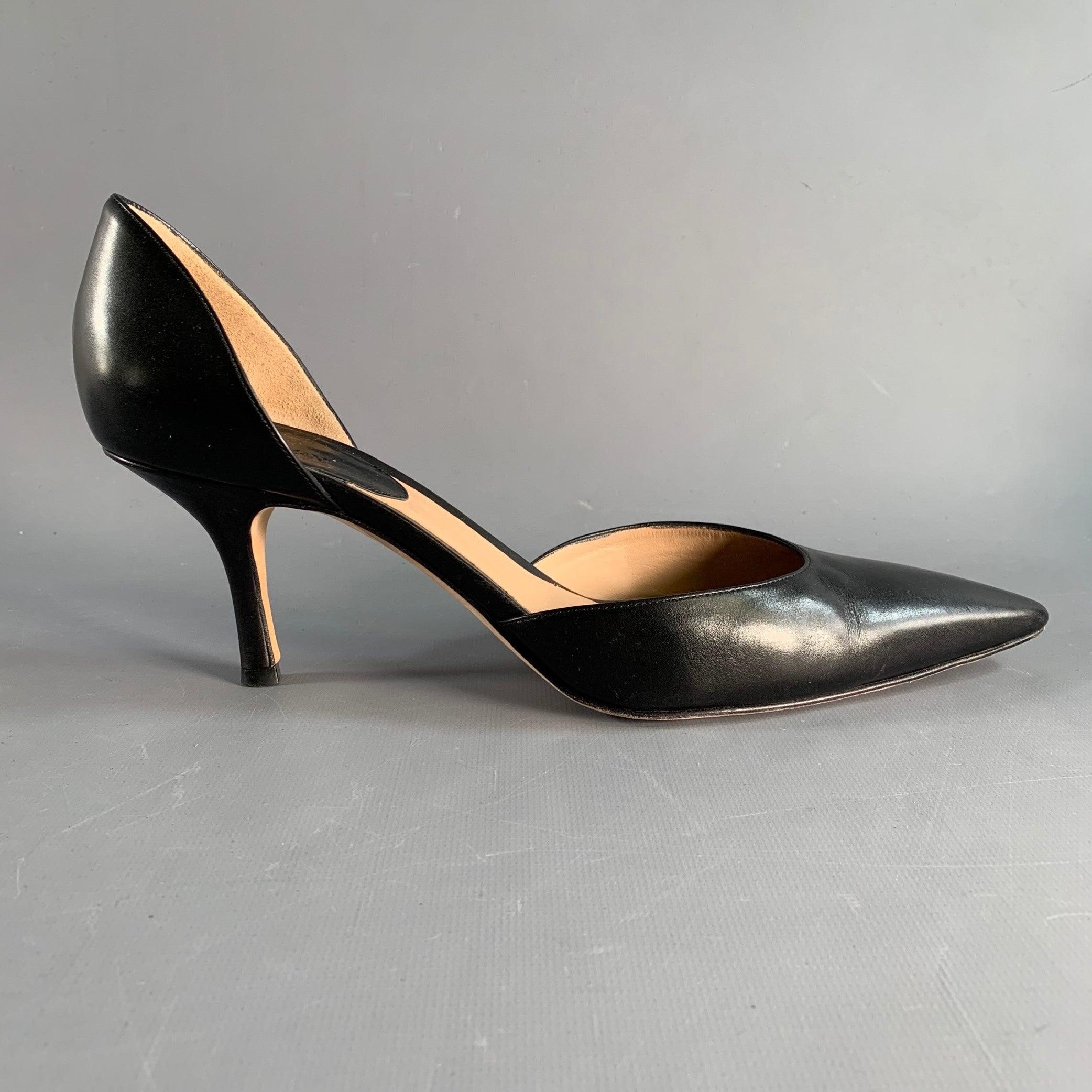GIORGIO ARMANI d'Orsay pumps in a black leather featuring a pointed toe. Made in Italy.Very Good Pre-Owned Condition. Moderate signs of wear. 

Marked:   XGDP48 44 41 1/2 

Measurements: 
  Heel: 3.5 inches  
  
  
 
Sui Generis Reference: