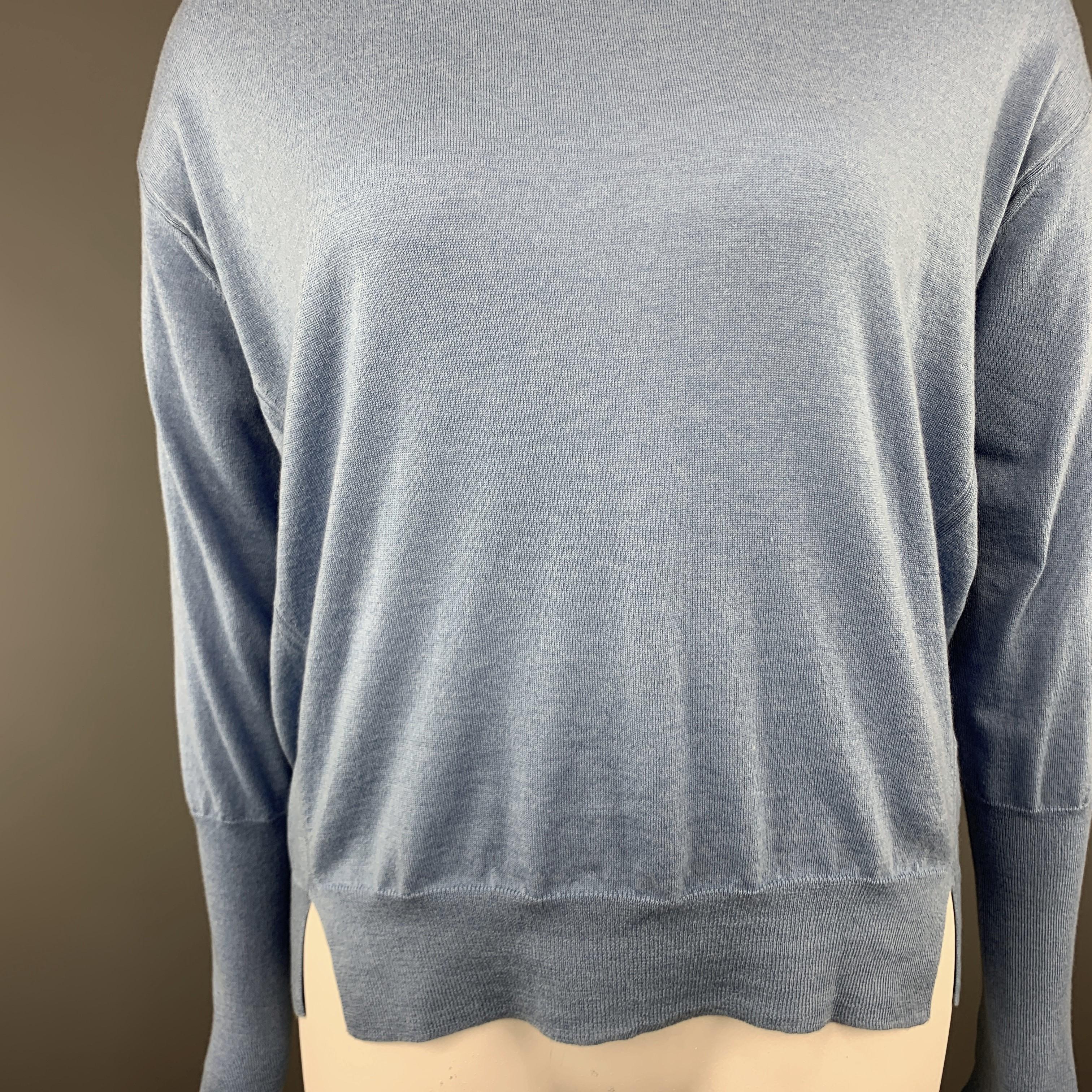 GIORGIO ARMANI pullover sweater comes in light blue cashmere knit with a round neck, slit waistband, and lone sleeves with extended cuff. Made in Italy.

Excellent Pre-Owned Condition.
Marked: EU 48

Measurements:

Shoulder: 23 in.
Bust: 50