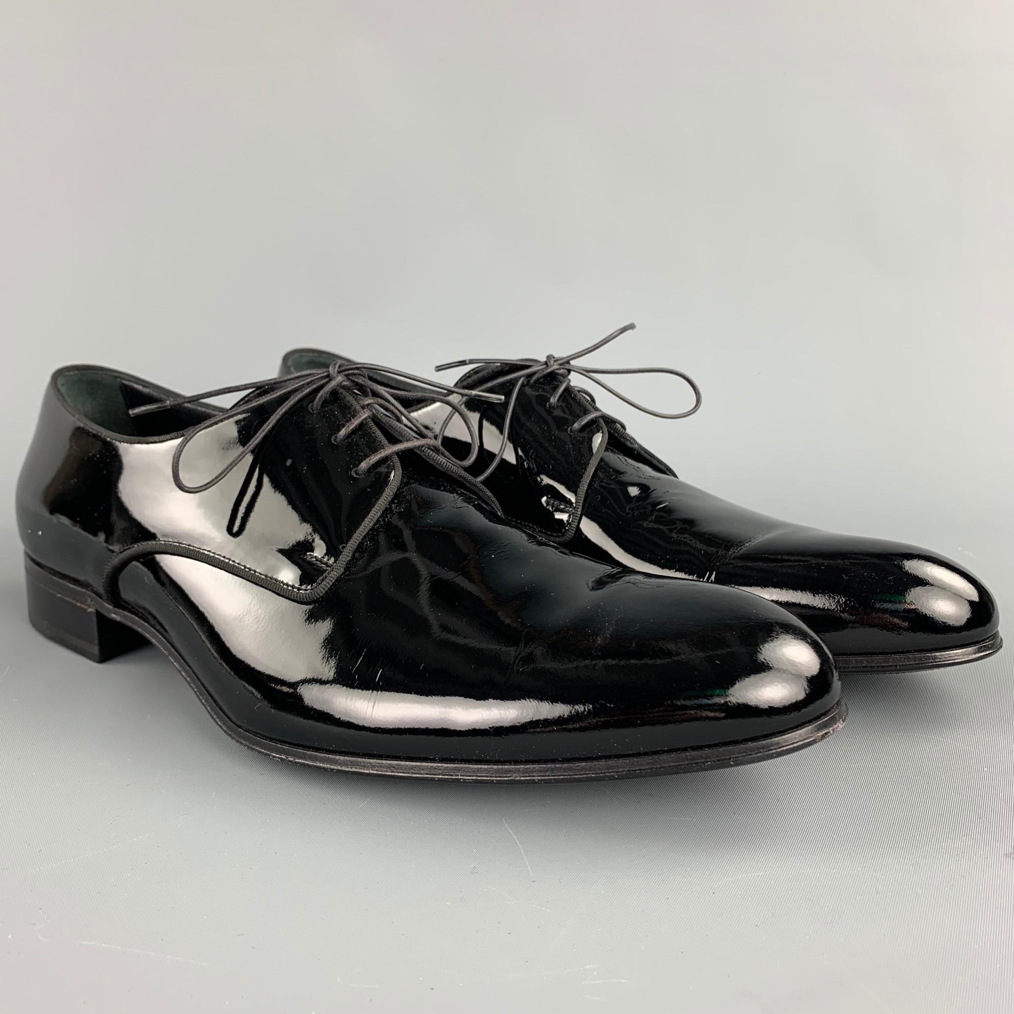 GIORGIO ARMANI dress shoes comes in a black patent leather featuring a wooden sole and a lace up closure. Comes with box. Made in Italy.

Very Good Pre-Owned Condition.
Marked: EU 46
Original Retail Price: $675.00

Outsole:

13 in. x 4 in. 