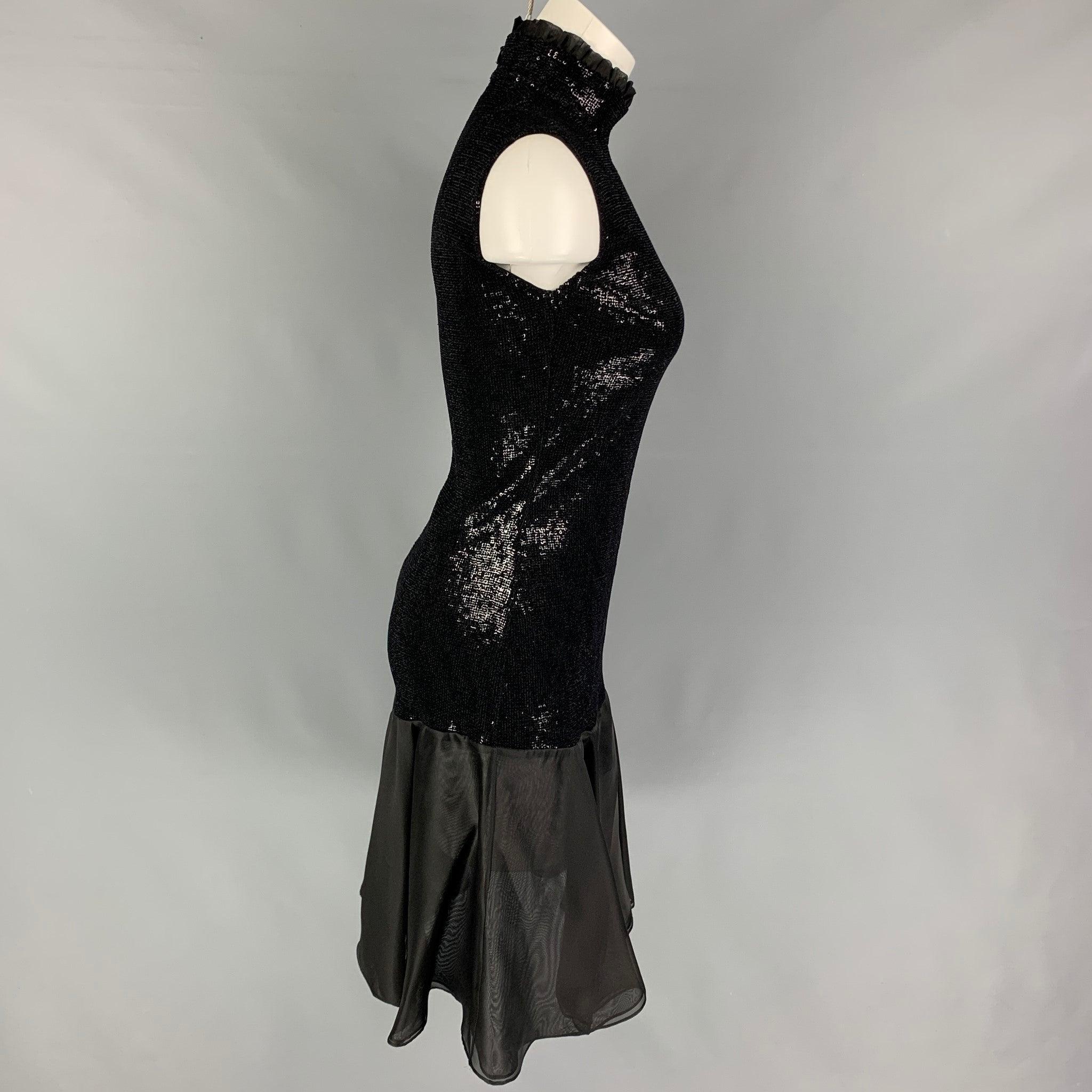 GIORGIO ARMANI dress comes in a black sequined viscose blend featuring a high collar, sleeveless, flared hem, and a back zip up closure. Made in Italy.
Very Good
Pre-Owned Condition. 

Marked:   38 

Measurements: 
 
Shoulder: 15 inches  Bust: 28