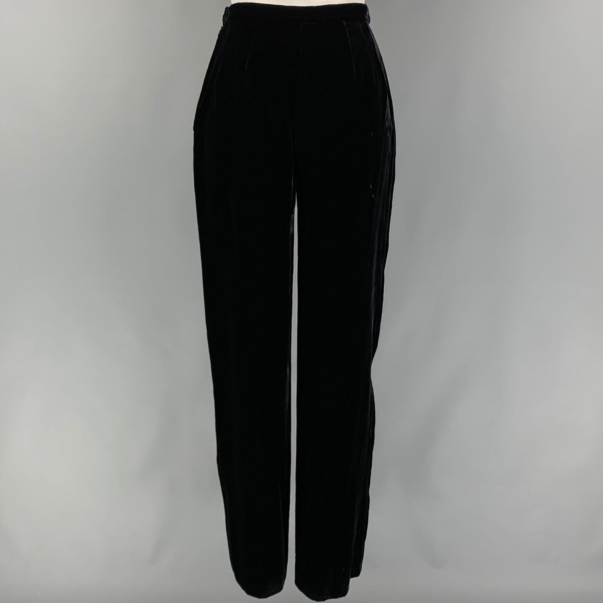 GIORGIO ARMANI pants comes in a black velvet viscose blend featuring a high waist, wide leg, and a side button & zipper closure. Made in Italy.
 Very Good
 Pre-Owned Condition. 
 

 Marked:  38 
 

 Measurements: 
  Waist: 24 inches Rise: 11.5