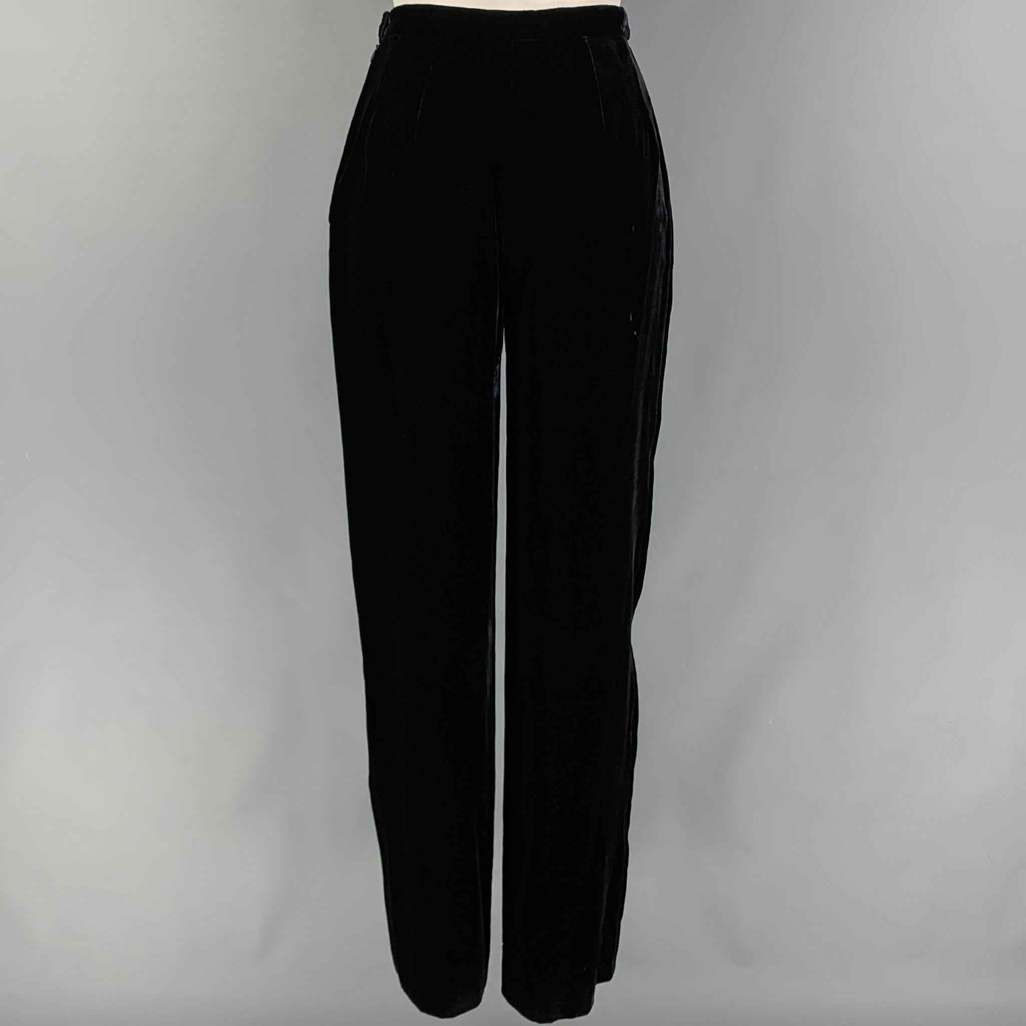 GIORGIO ARMANI pants comes in a black velvet viscose blend featuring a high waist, wide leg, and a side button & zipper closure. Made in Italy. 

Very Good Pre-Owned Condition.
Marked: 38

Measurements:

Waist: 24 in.
Rise: 11.5 in.
Inseam: 31 in. 