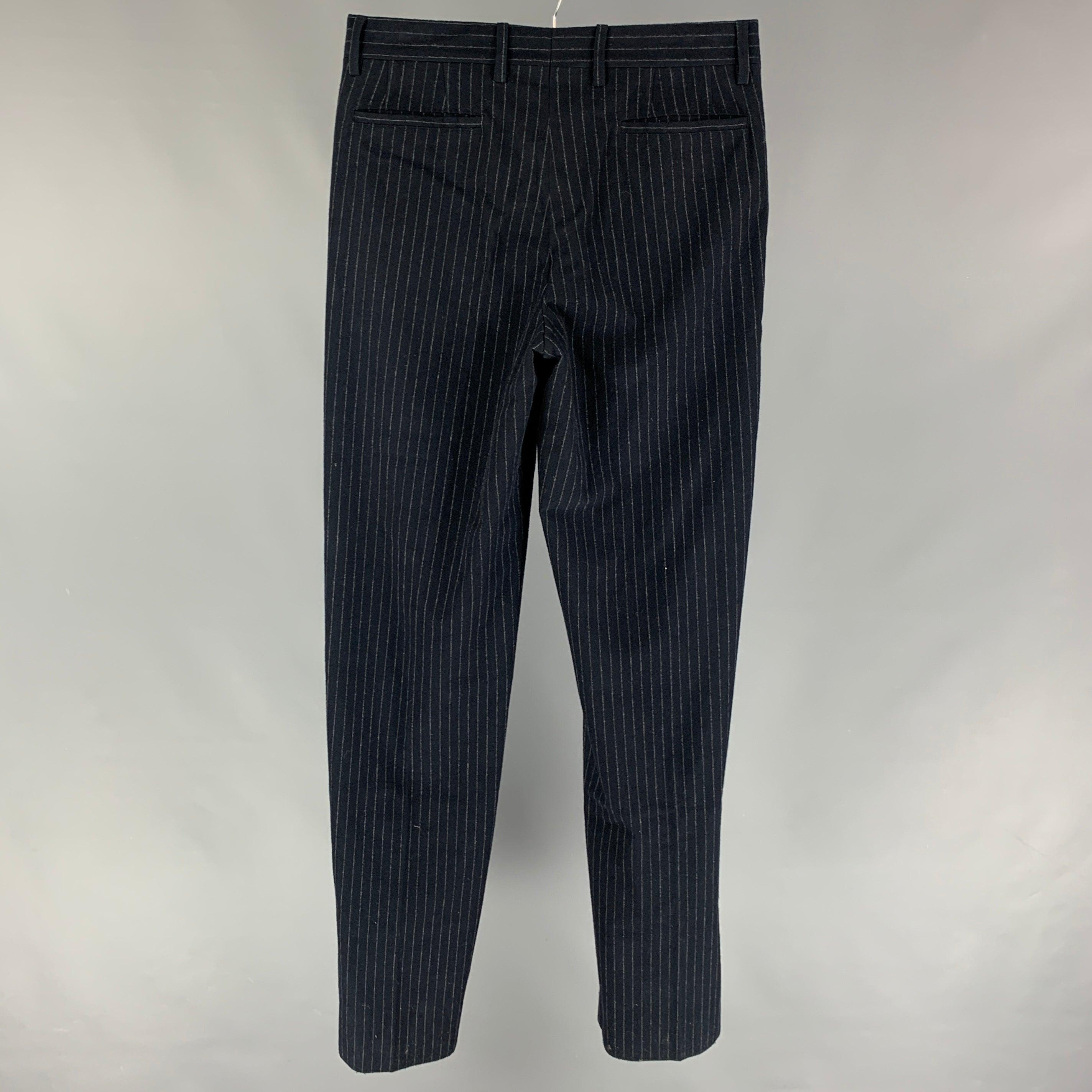 GIORGIO ARMANI dress pants comes in a navy pinstripe wool blend featuring a flat front and a zip fly closure. Made in Italy.
 New With Tags.
  
 

 Marked:  48 
 

 Measurements: 
  Waist: 32 inches Rise: 11 inches Inseam: 38 inches 
  
  
  
 Sui