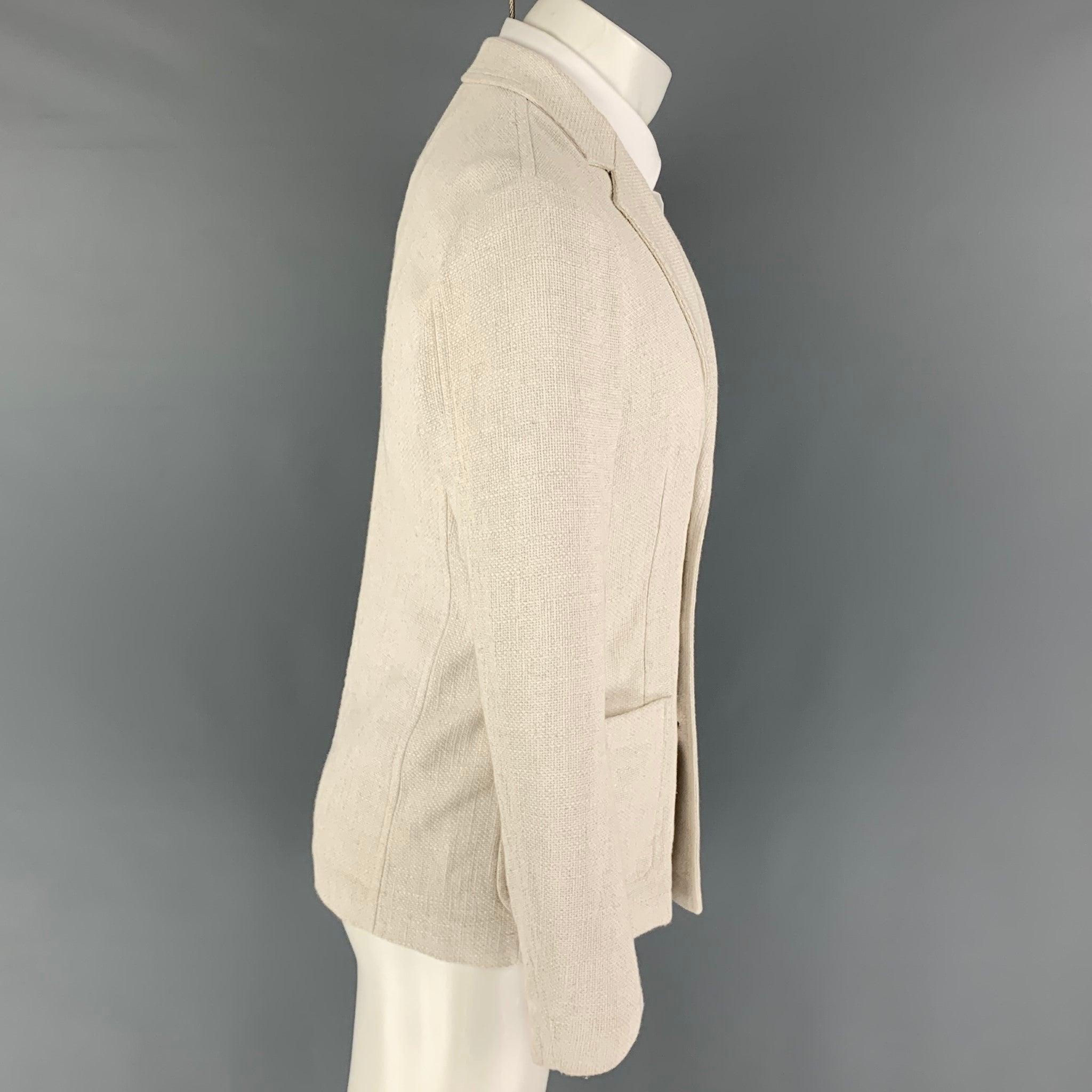 GIORGIO ARMANI sport coat comes in a off white woven viscose blend featuring a notch lapel, patch pockets, and a double breasted closure. Made in Italy.
Excellent
Pre-Owned Condition. 

Marked:   46 

Measurements: 
 
Shoulder: 17 inches Chest: 36