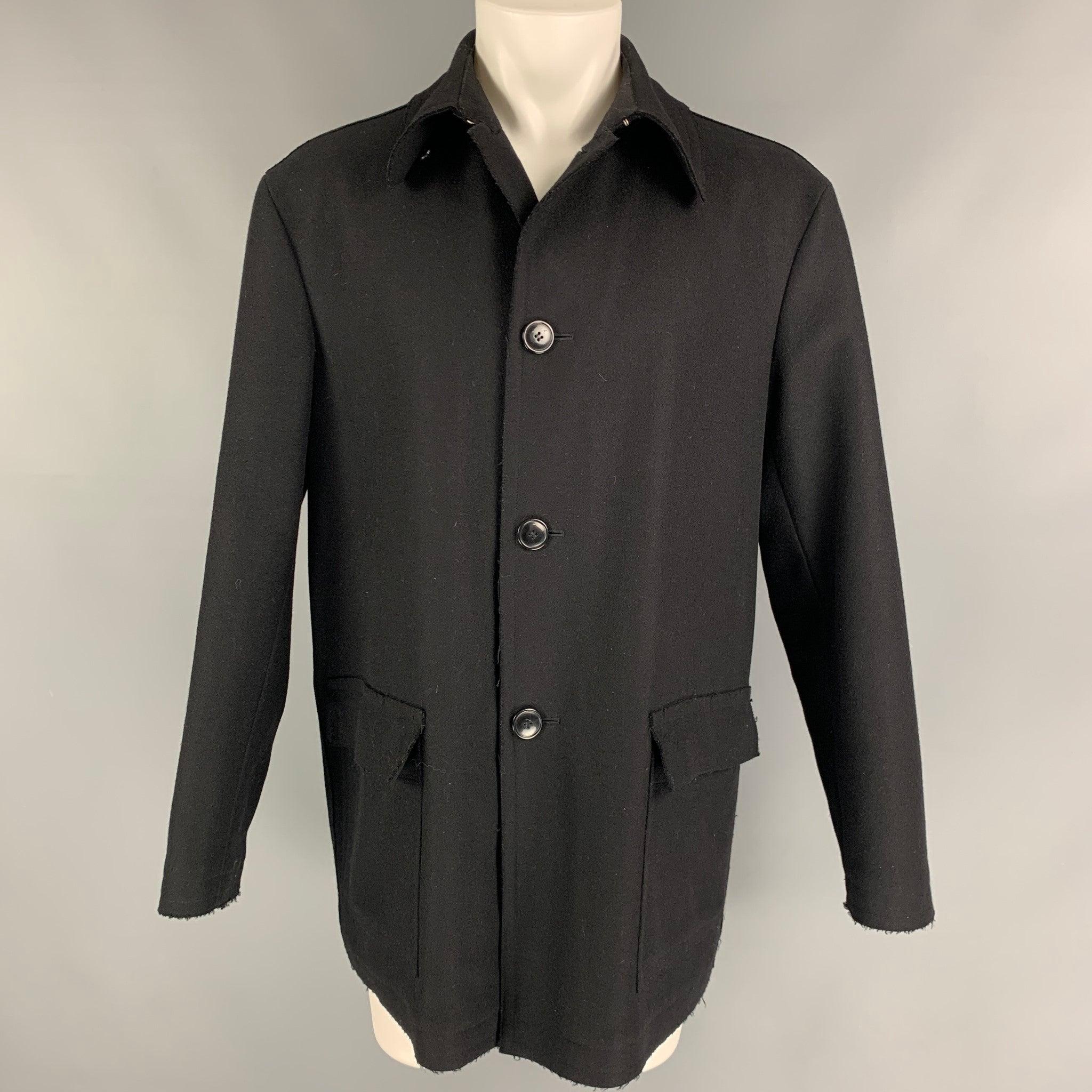 Giorgio Armani black 100% wool single breasted peacoat with flap pockets and nylon lining.Round buttons and clasp beneath collar.Made in Italy.Good Pre-Owned Condition. 

Marked: 48 

Measurements: 
 
Shoulder: 22 InchesChest:48 InchesSleeve:26