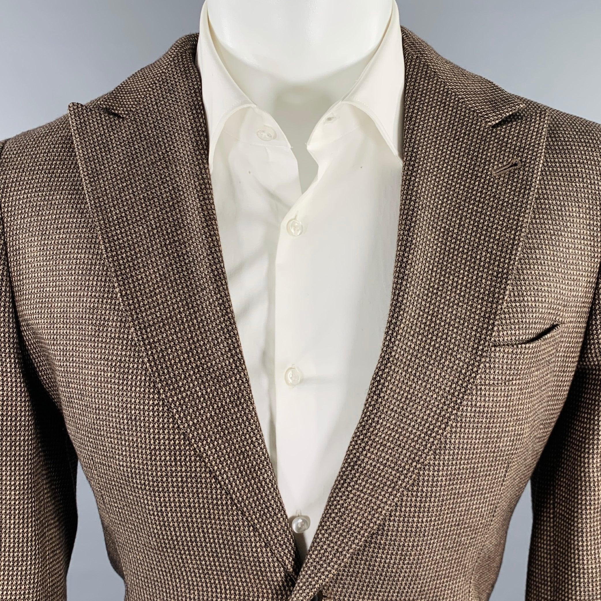 GIORGIO ARMANI sport coat
in a brown and beige fabric featuring a woven pattern, peak lapel, ventless back, and double button closure. Made in Italy.Excellent Pre-Owned Condition. 

Marked:   IT 48 

Measurements: 
 
Shoulder: 17 inches Chest: 38
