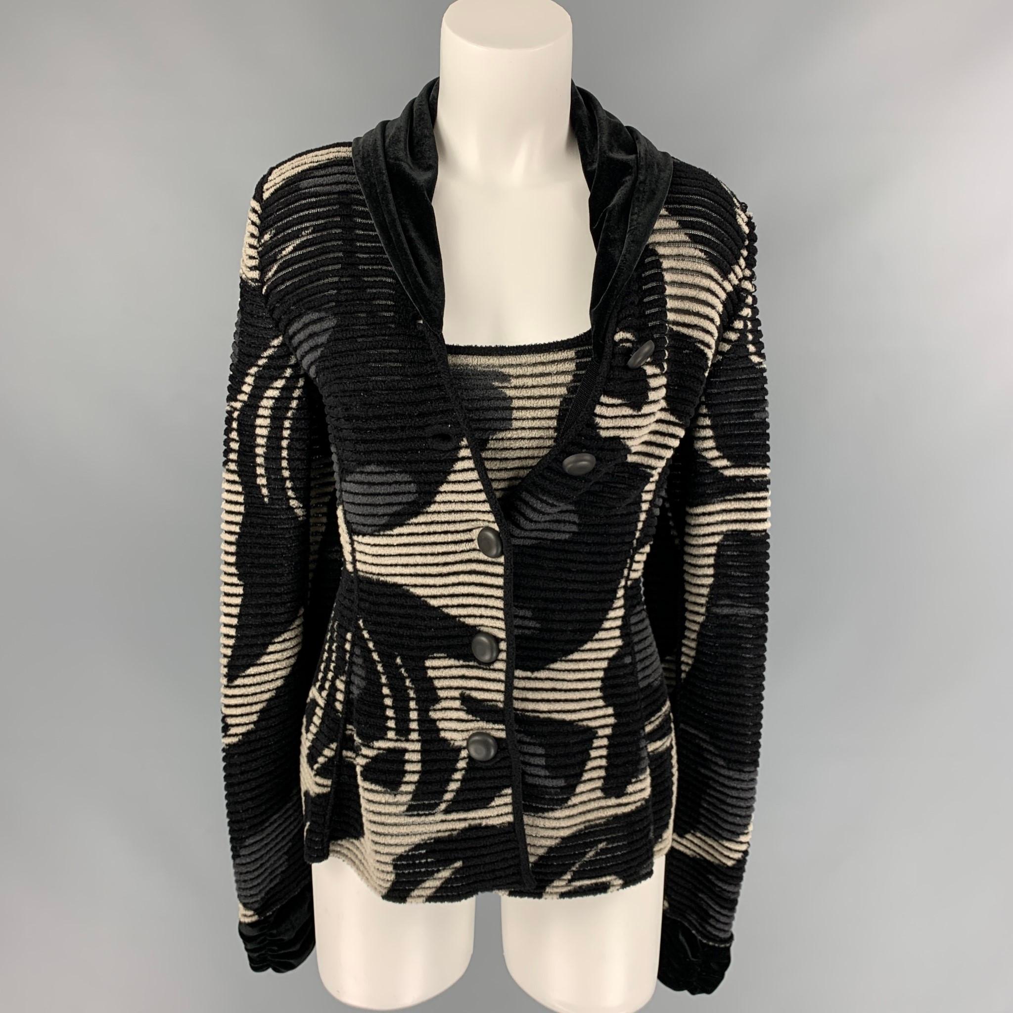 GIORGIO ARMANI 2 Piece cardigan set comes in a black & grey knitted viscose / polyamide featuring a velvet trim, buttoned closure, and a matching camisole. Made in Italy. 

Very Good Pre-Owned Condition.
Marked: